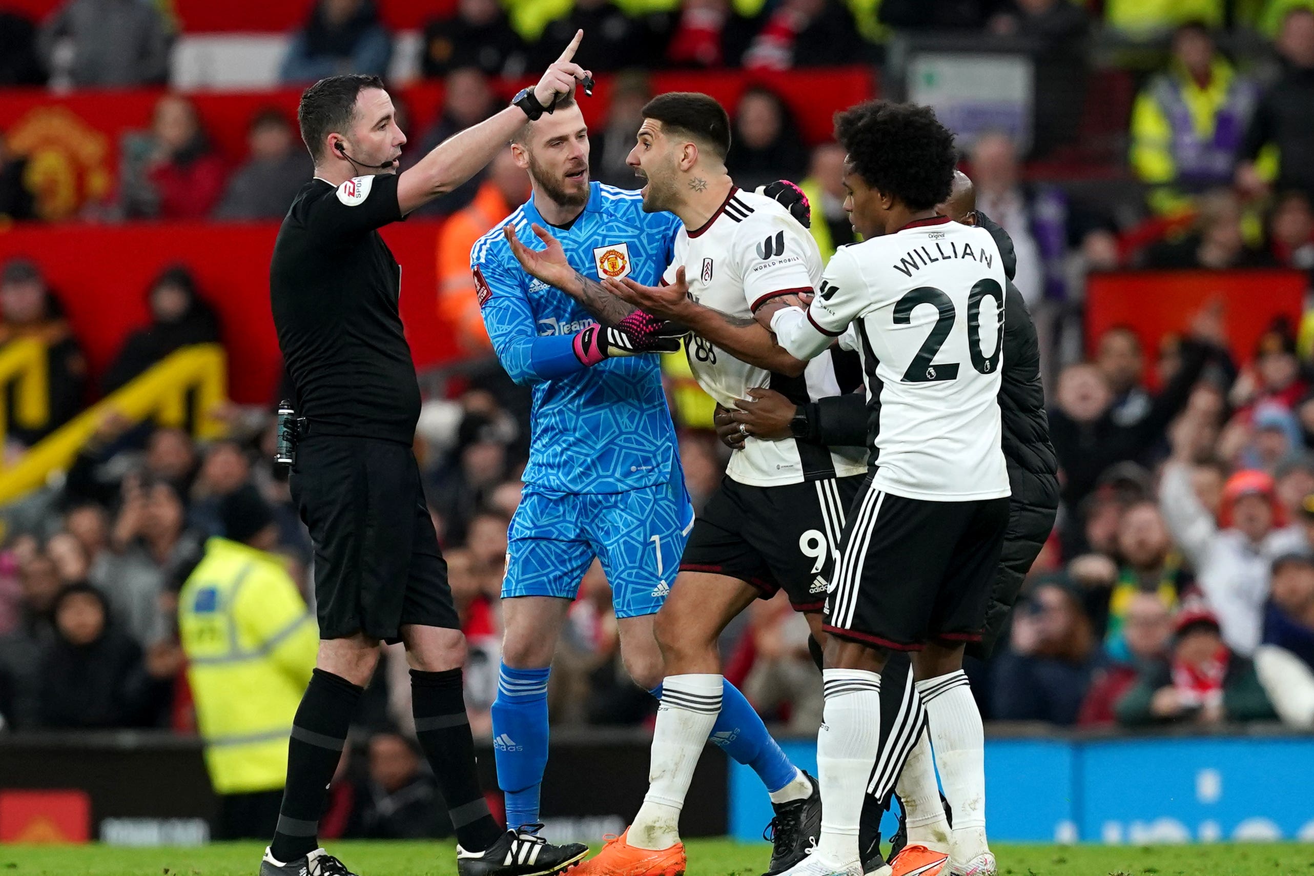 Mitrovic (centre) is sent off by referee Kavanagh