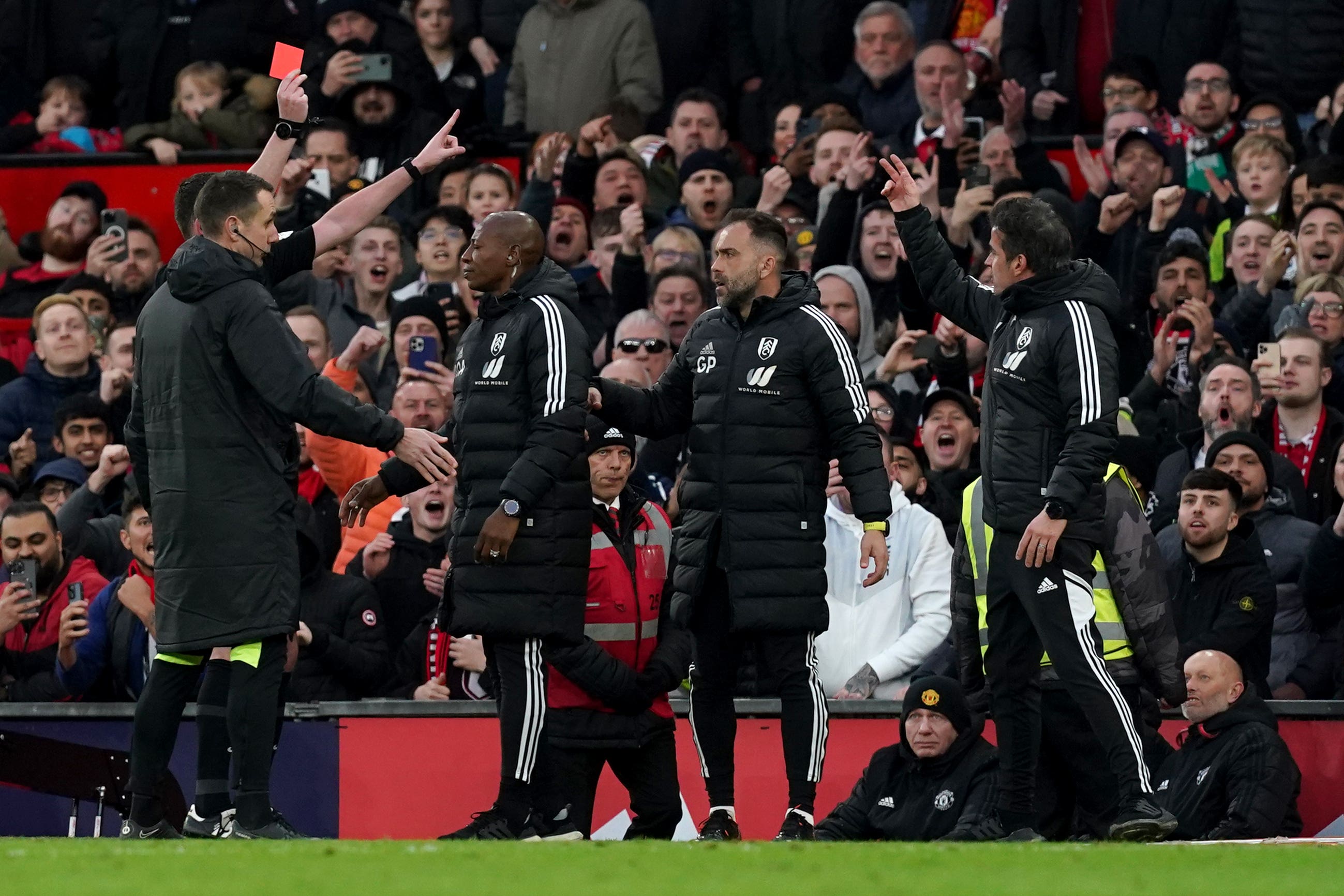 Marco Silva (right) is shown the first of Fulham’s three red cards in a minute (Martin Rickett/PA)