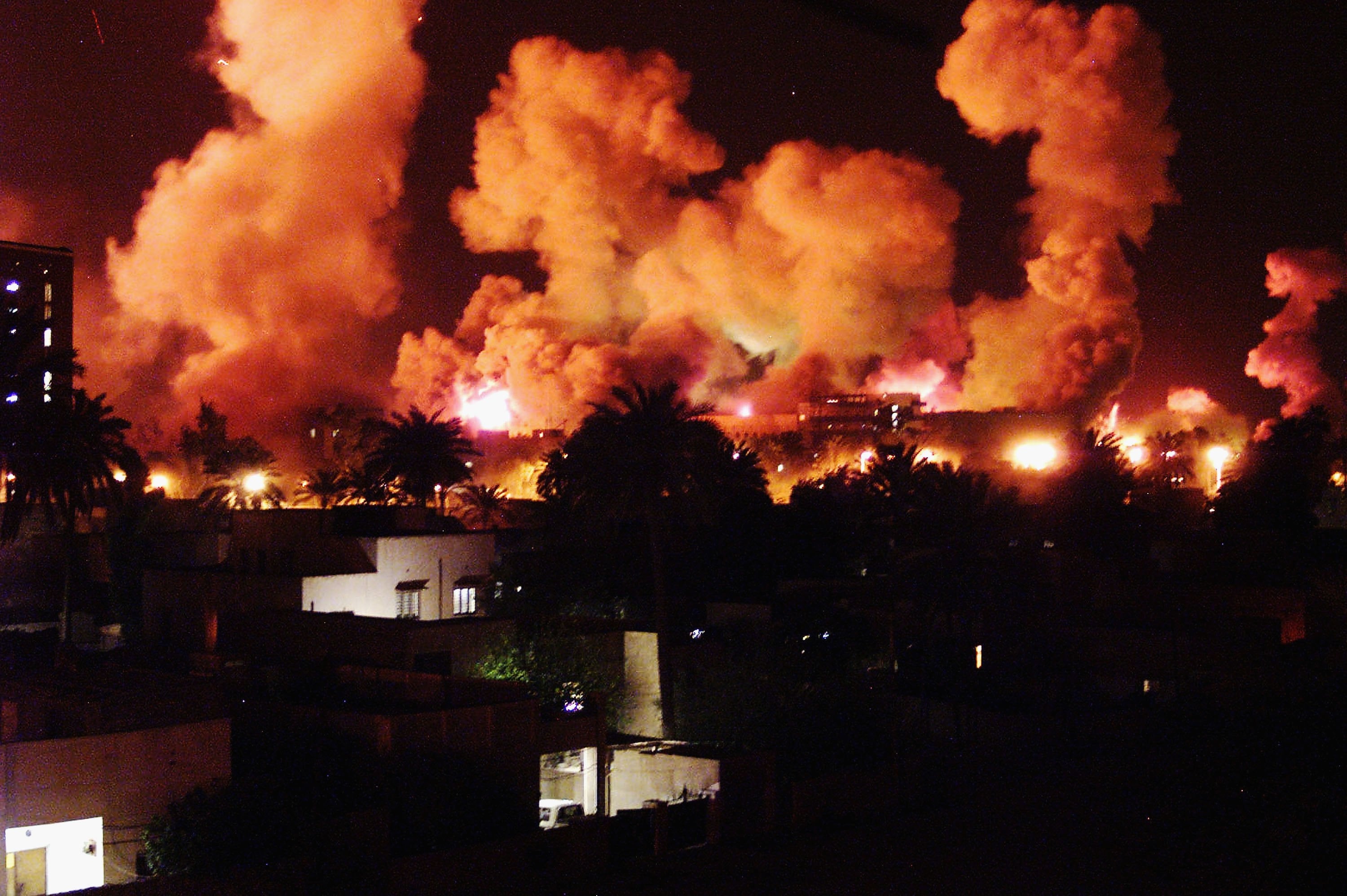 Smoke rises from explosions in Baghdad during the first few minutes of an air attack on 21 March, 2003