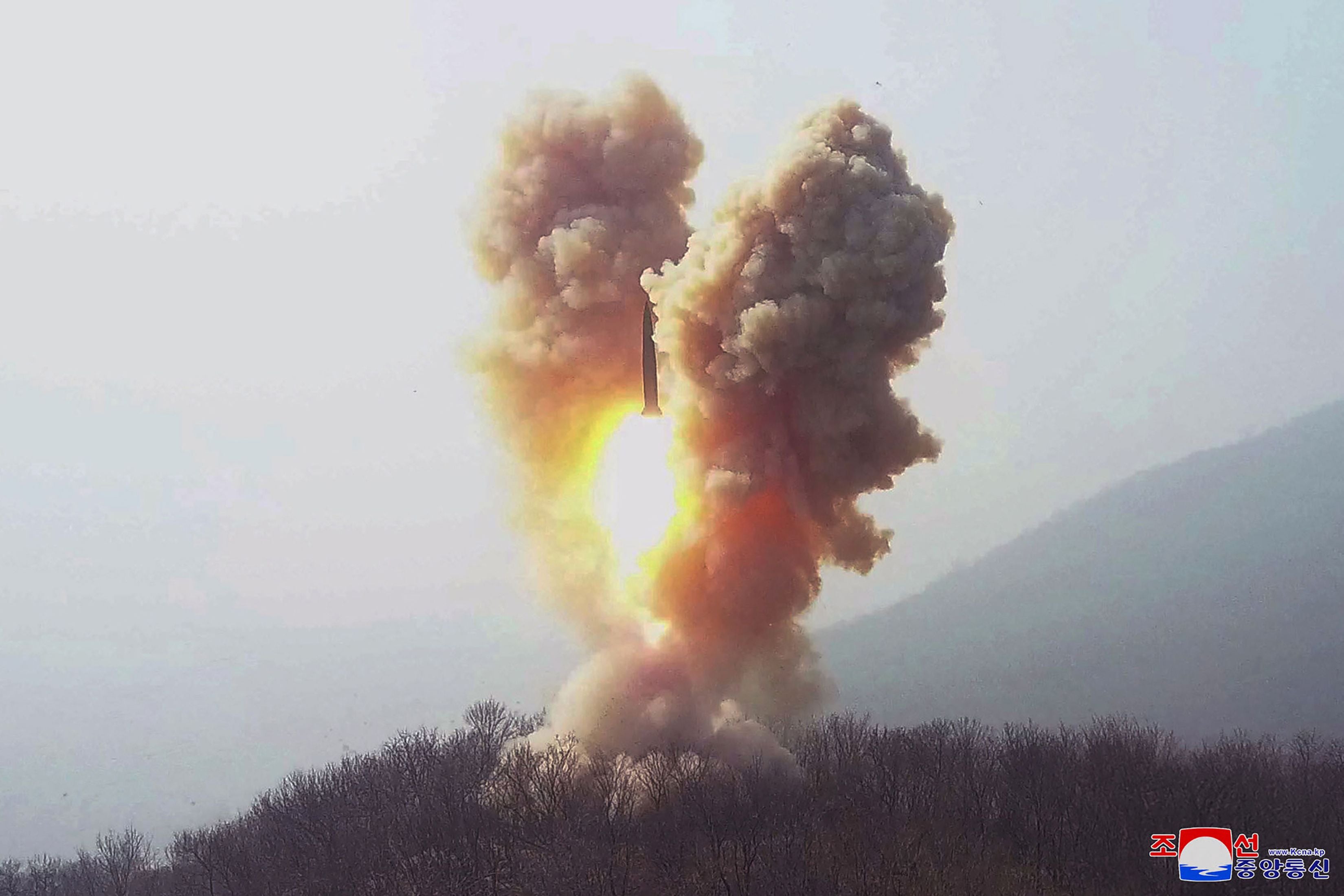 This picture taken on 19 March shows a warhead missile launch exercise simulating a tactical nuclear attack in Cholsan county, North Pyongan province