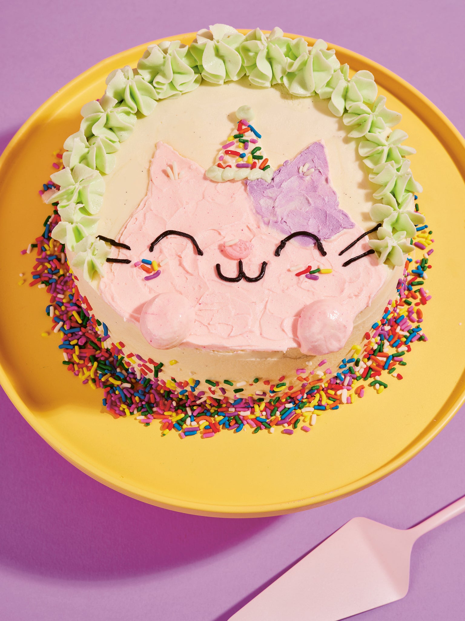 This pink and purple iced cake is purrfect for any cat-lover’s birthday