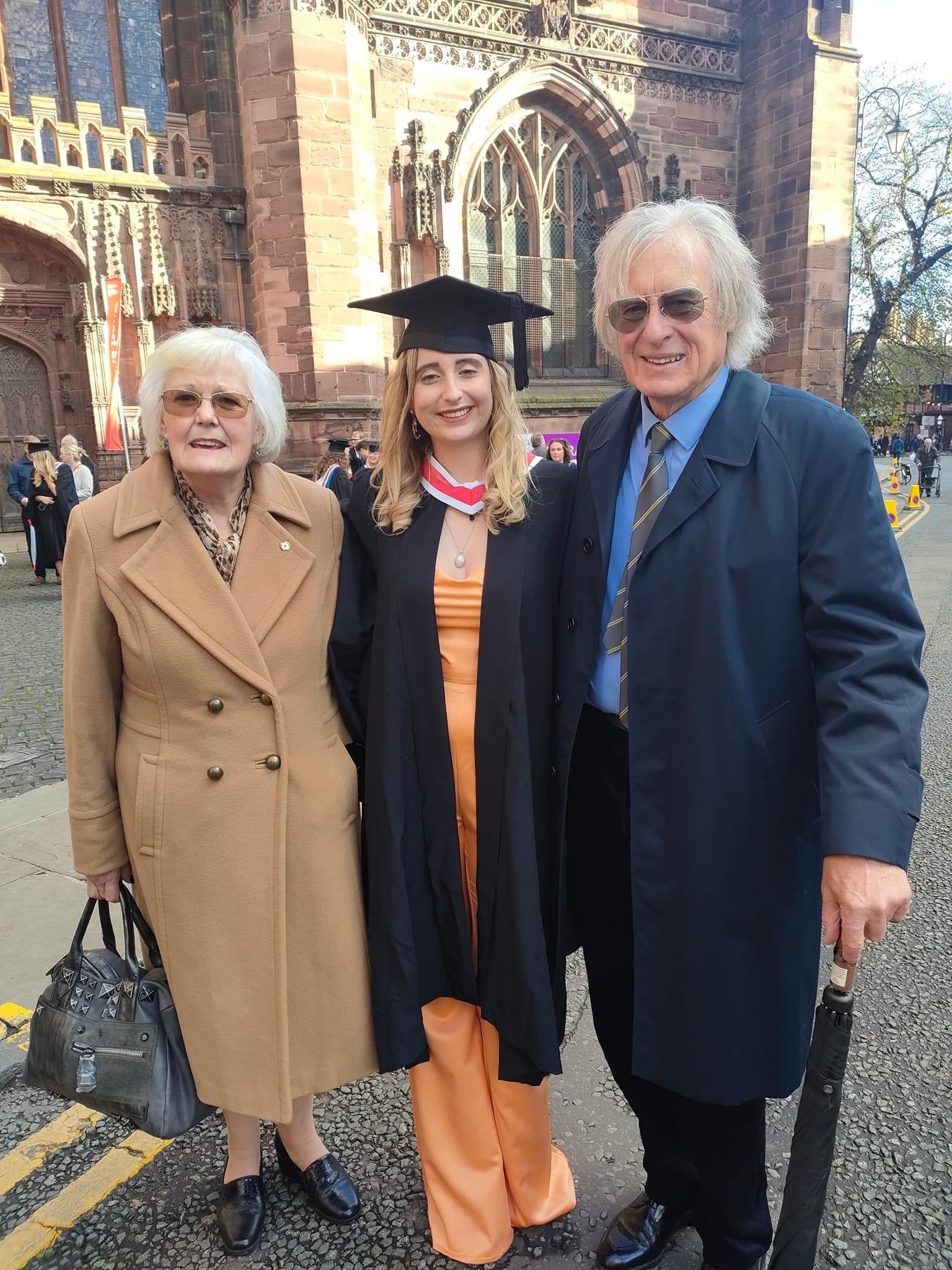 Ms Perceval-Maxwell (left) with her partner Paul at her granddaughter’s graduation