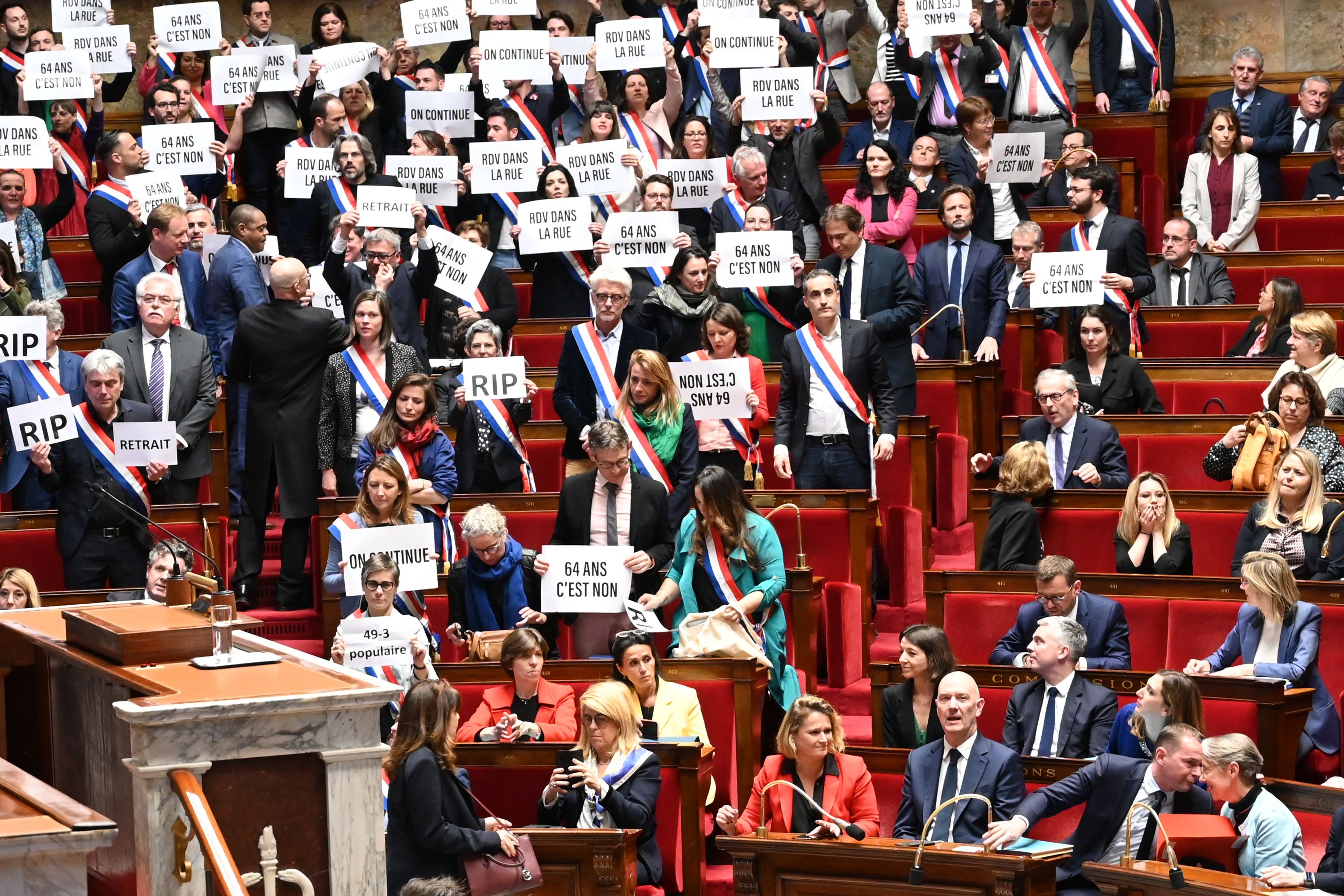 French prime minister Elisabeth Borne (bottom right) talks to labour minister Olivier Dussopt during the parliamentary protest