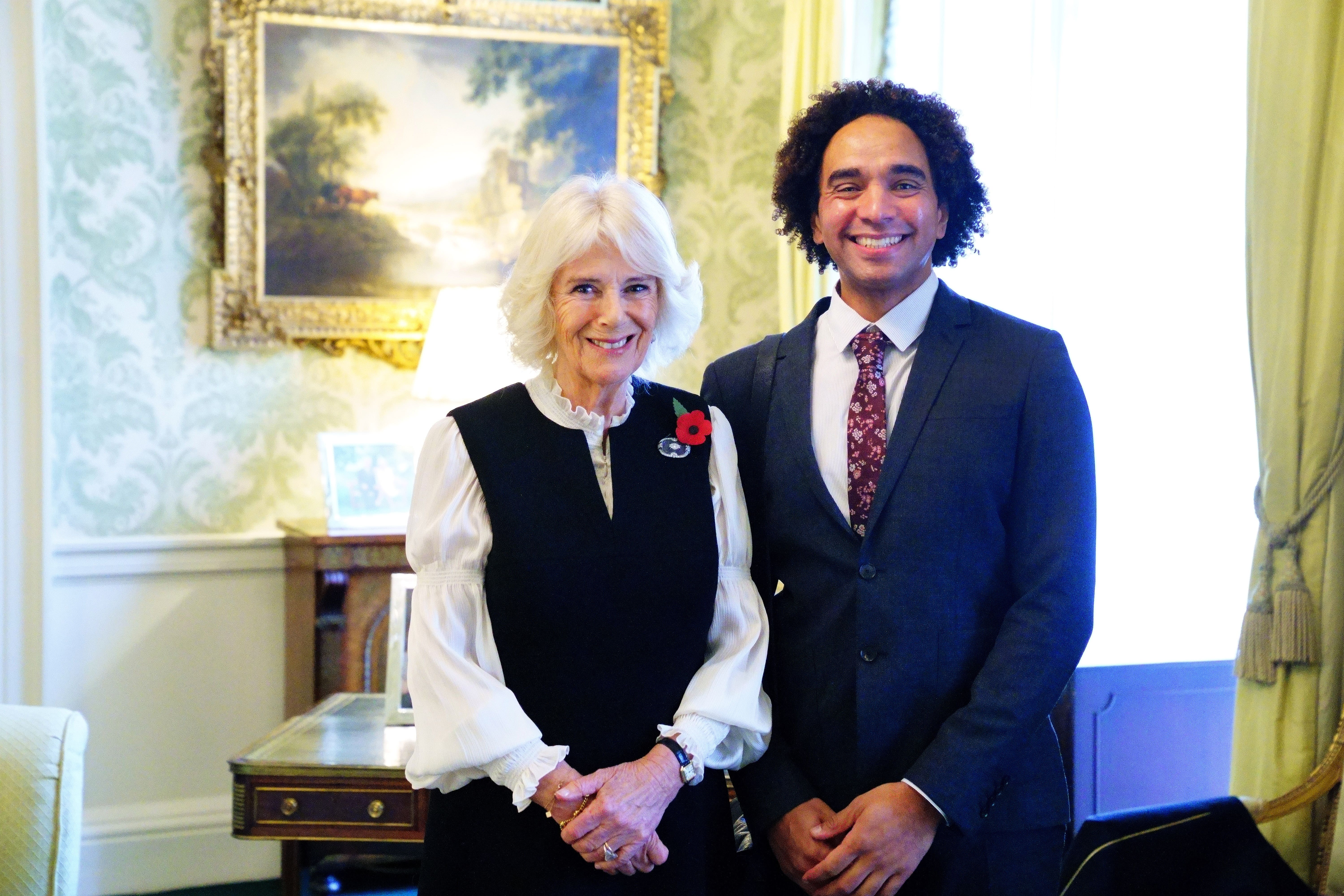 The Queen Consort with children’s laureate Joseph Coelho (Victoria Jones/PA)