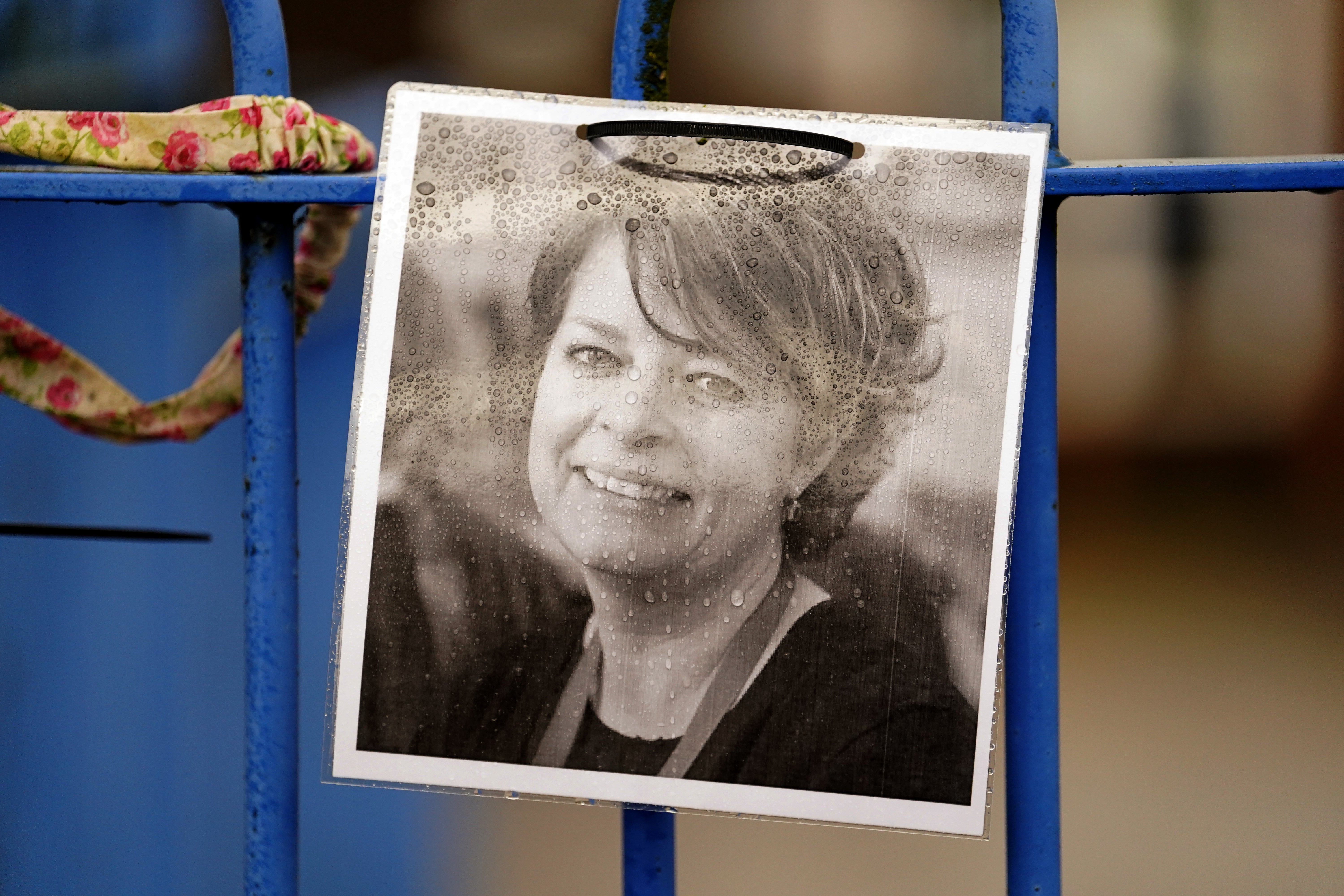 A photograph of Ruth Perry attached to the fence outside John Rankin Schools, where headteacher Flora Cooper is planning to refuse entry to Ofsted inspectors