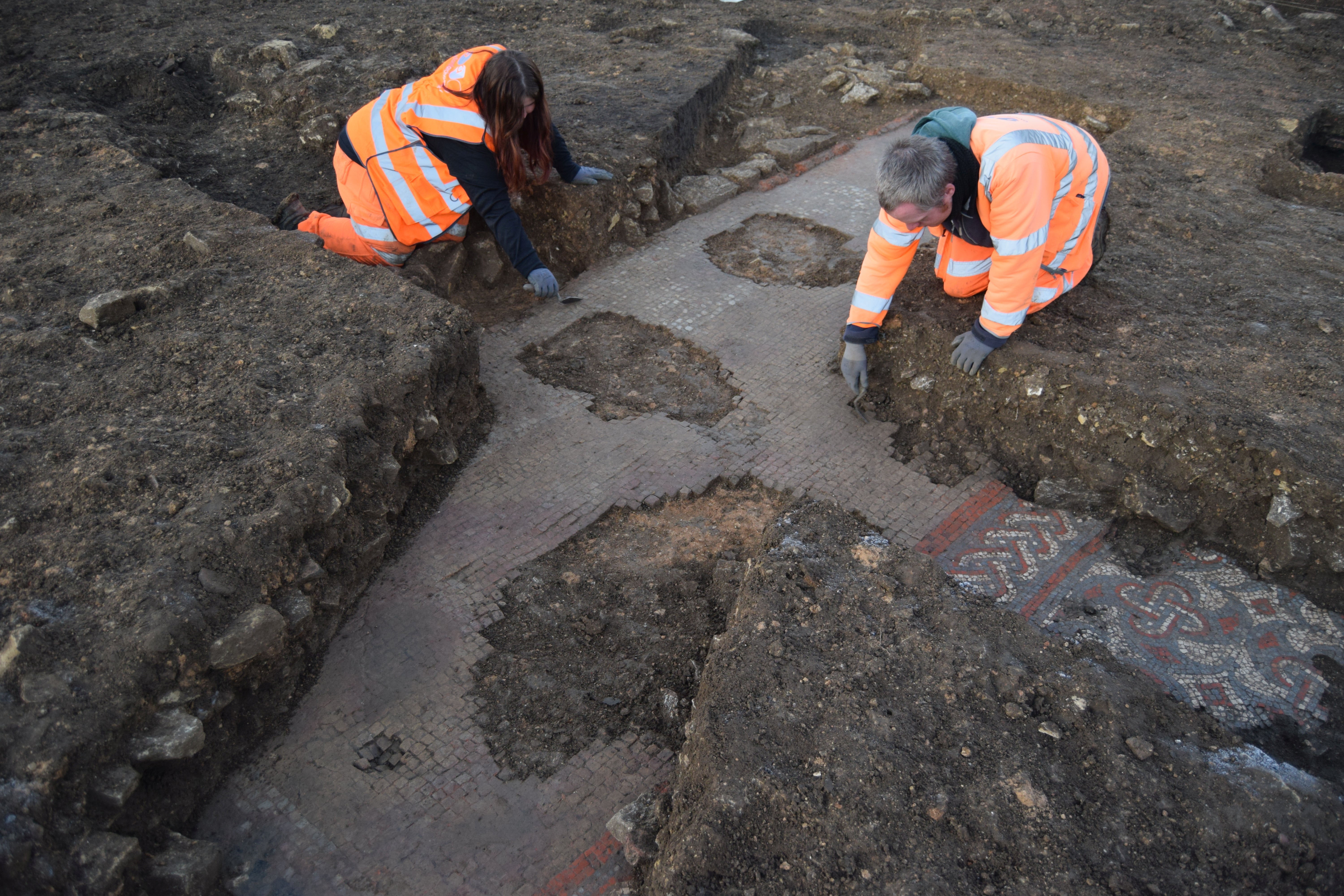 The team from Oxford Archeology found a beautiful mosaic floor made up of red, blue and white tiles