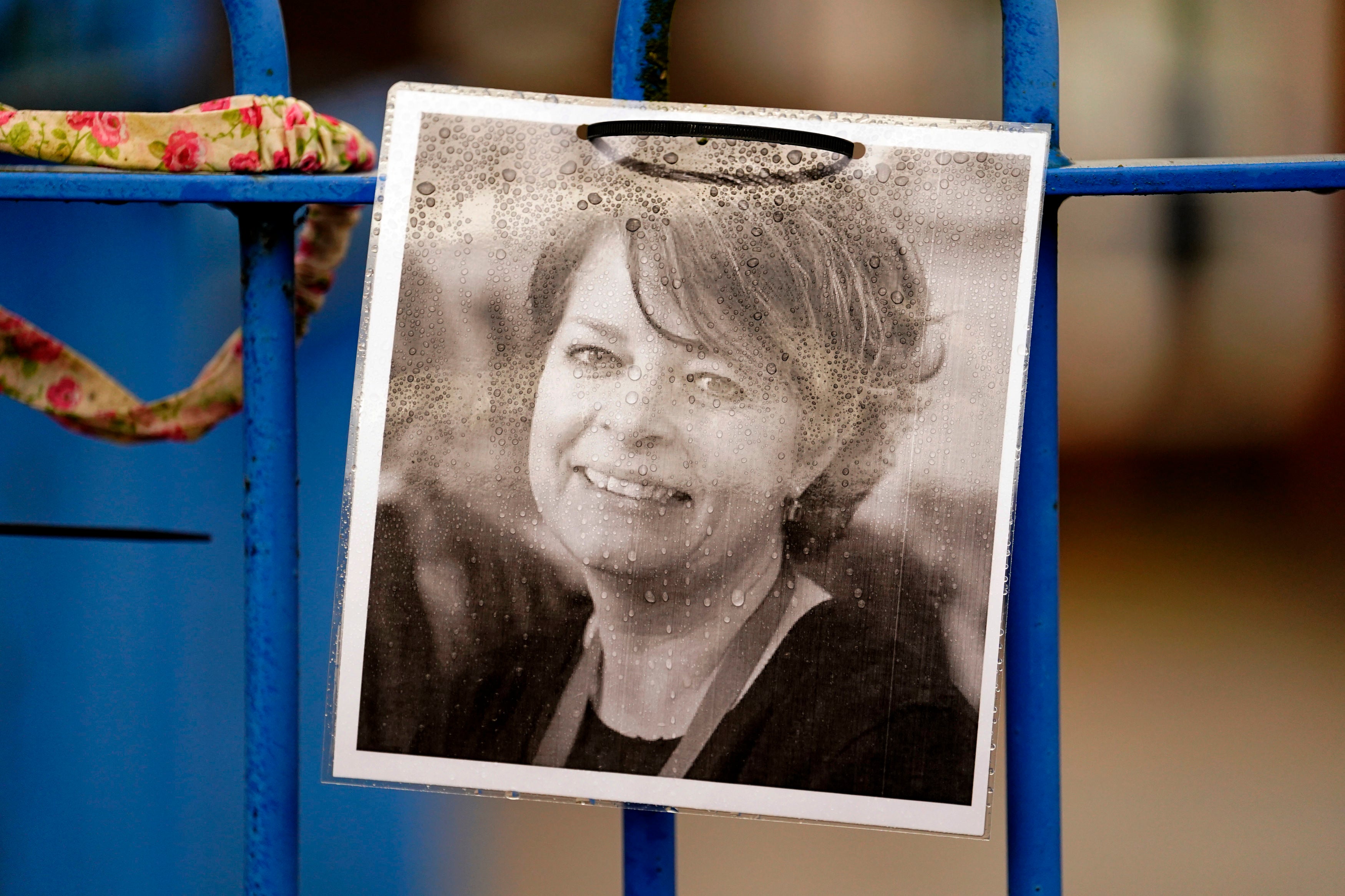 A photograph of Ruth Perry attached to the fence outside John Rankin Schools in Newbury where a headteacher planned to boycott Ofsted