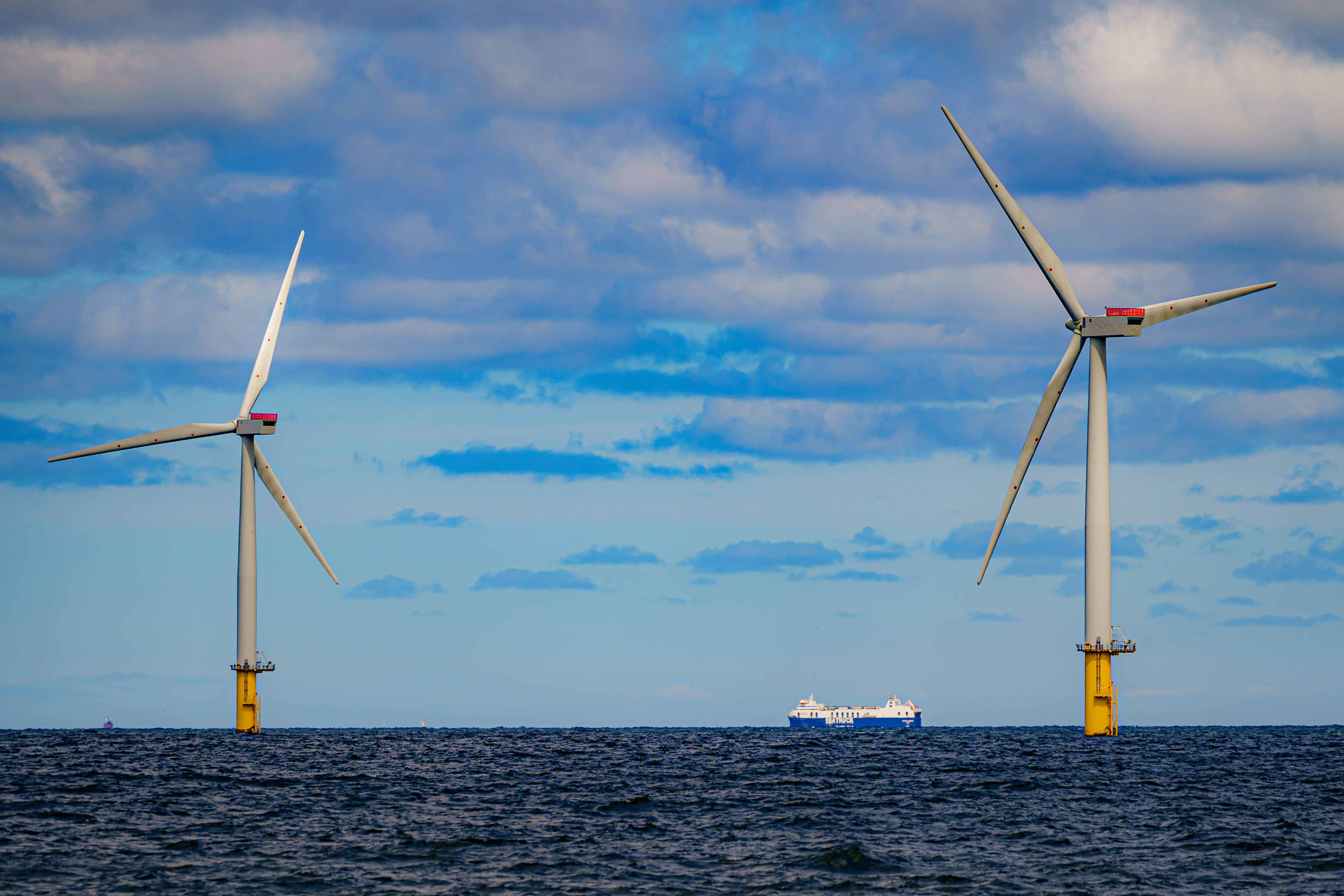 Wind and solar farms operate under the Contracts for Difference scheme which sets a specific price for the electricity that comes from many of the UK’s newer wind farms (Ben Birchall/PA)