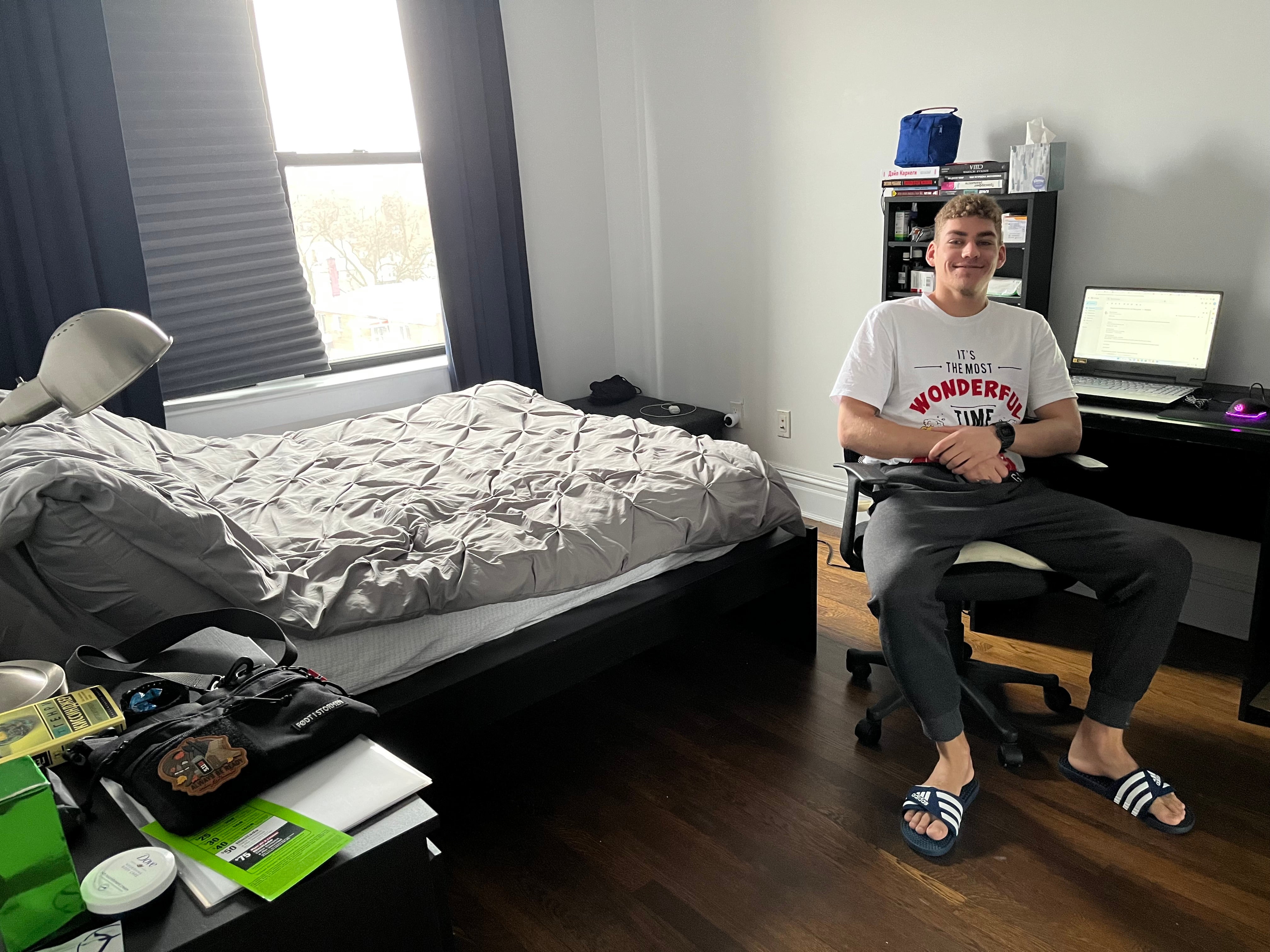 Dima in his new bedroom in Queens