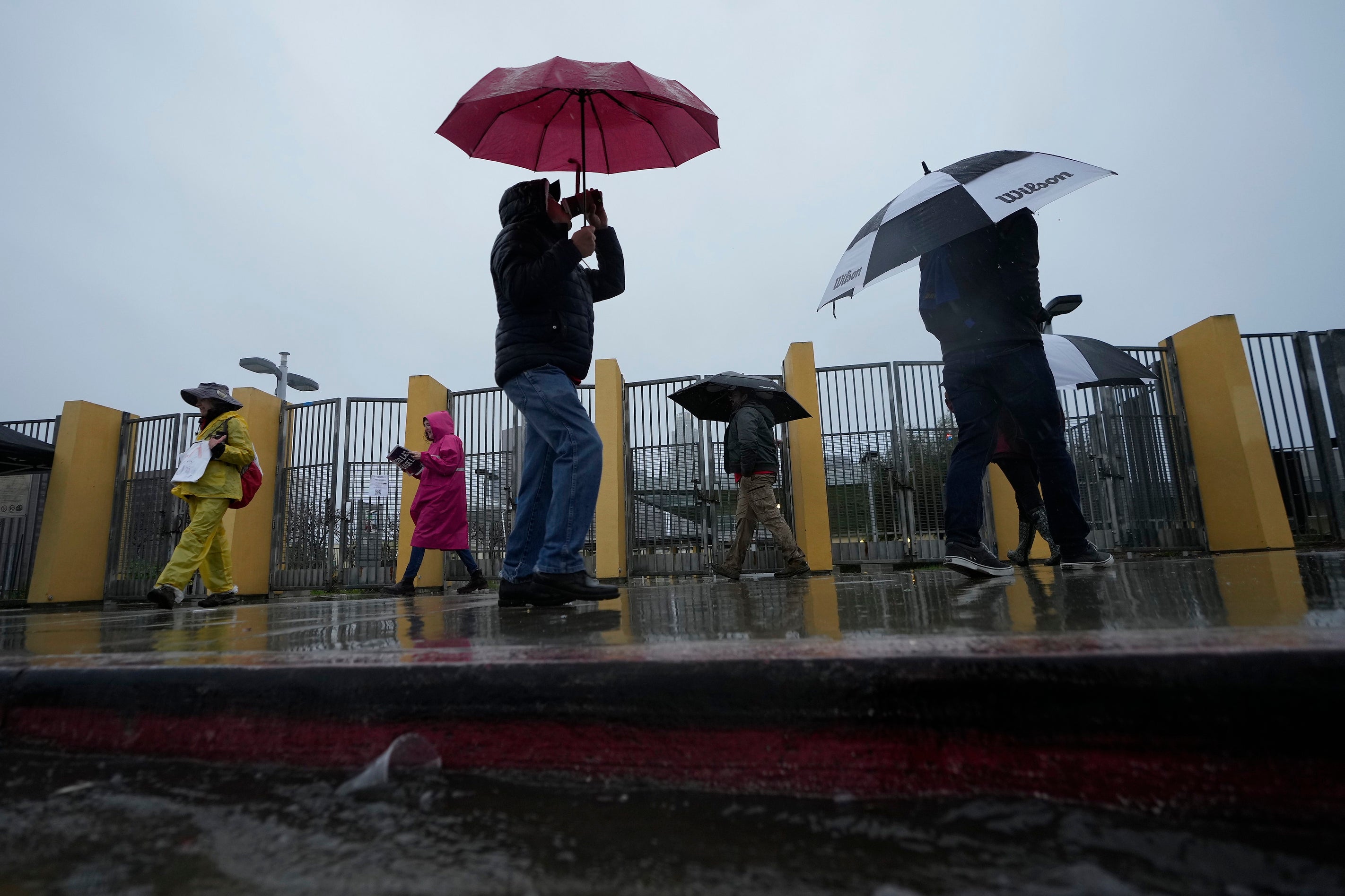 Los Angeles Unified School District, LAUSD teachers and Service Employees International Union 99 (SEIU) members strike during heavy rain outside the Edward R. Roybal Learning Center