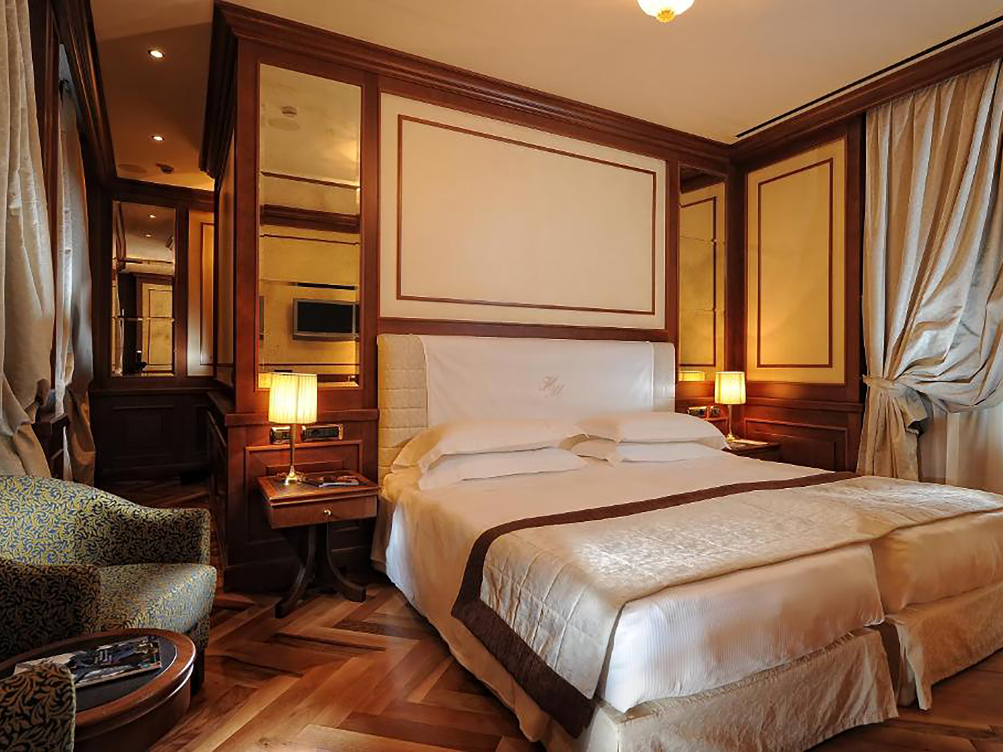 The traditional rooms come with polished wood and honey marble