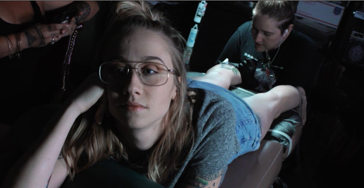 Emily Nestor is pictured in new documentary Citizen Sleuth getting both getting tattoos and having them removed