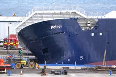 ‘Multiple injuries’ as huge ship topples over in dry dock during strong winds