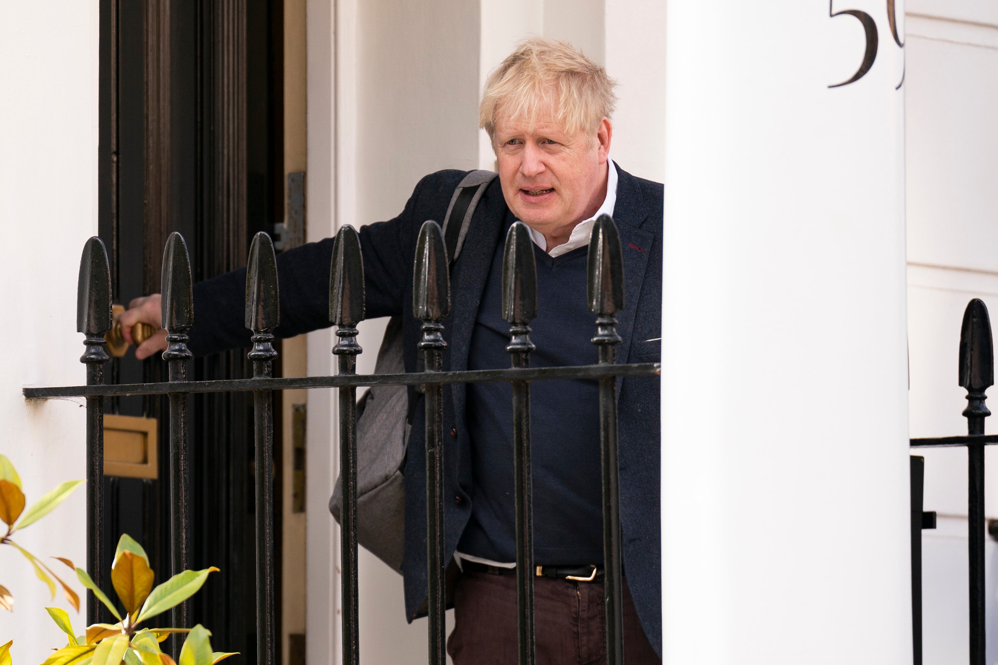 Johnson leaves his London home on the day after the Partygate hearing