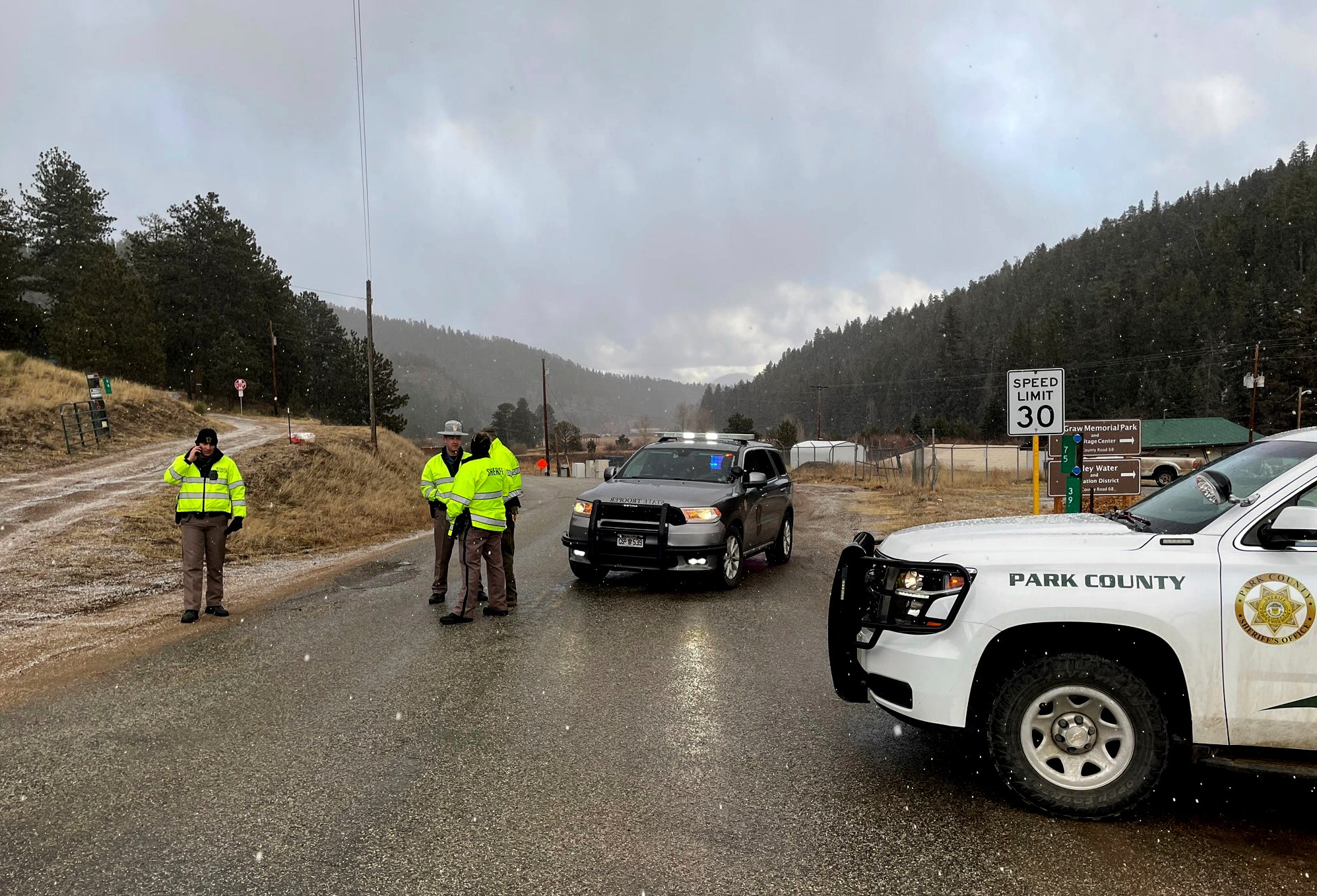 Sheriff deputies block a road in the town of Colorado where authorities found an abandoned car