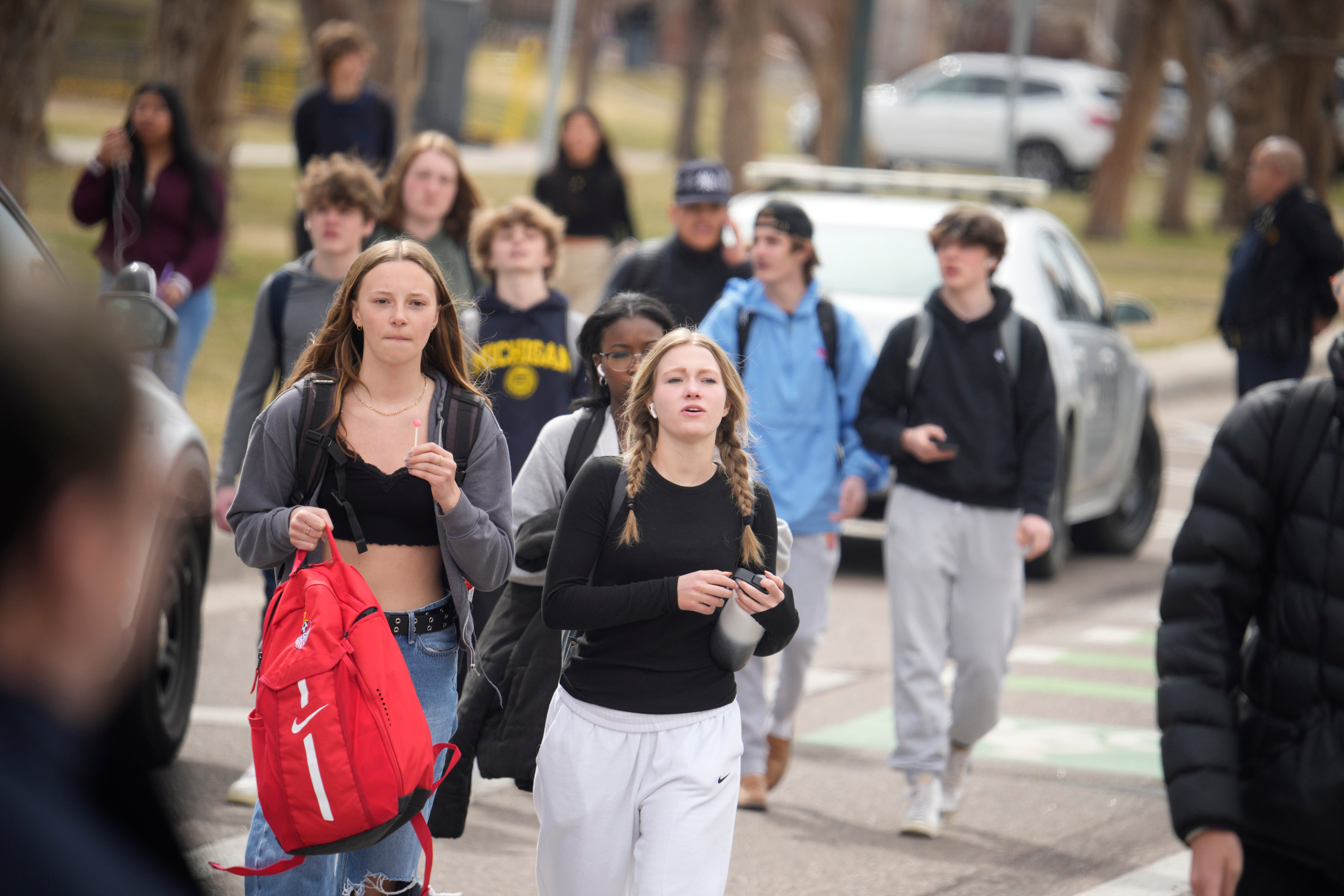 Students are walked out of East High School following shooting