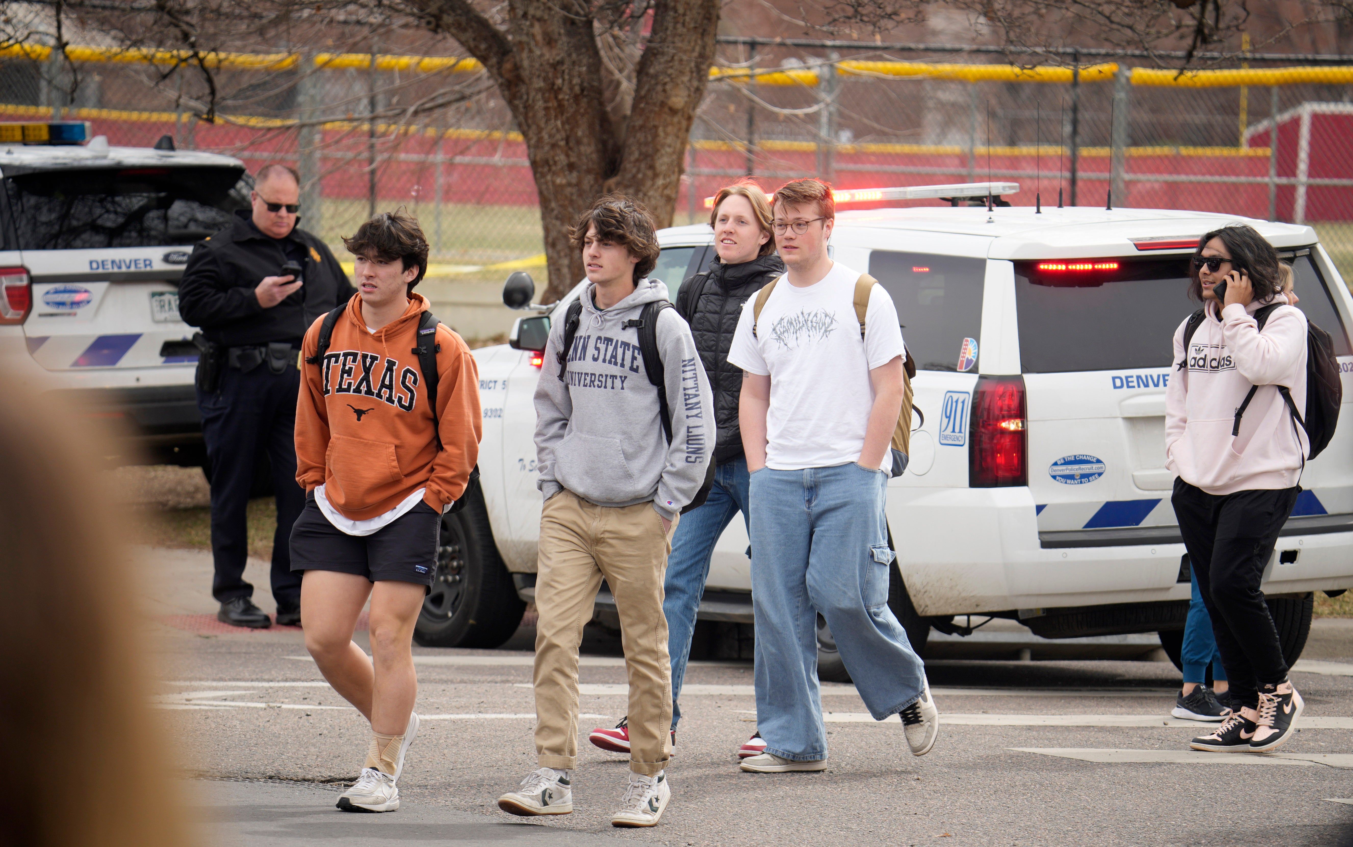 Students are led out of the high school after the shooting