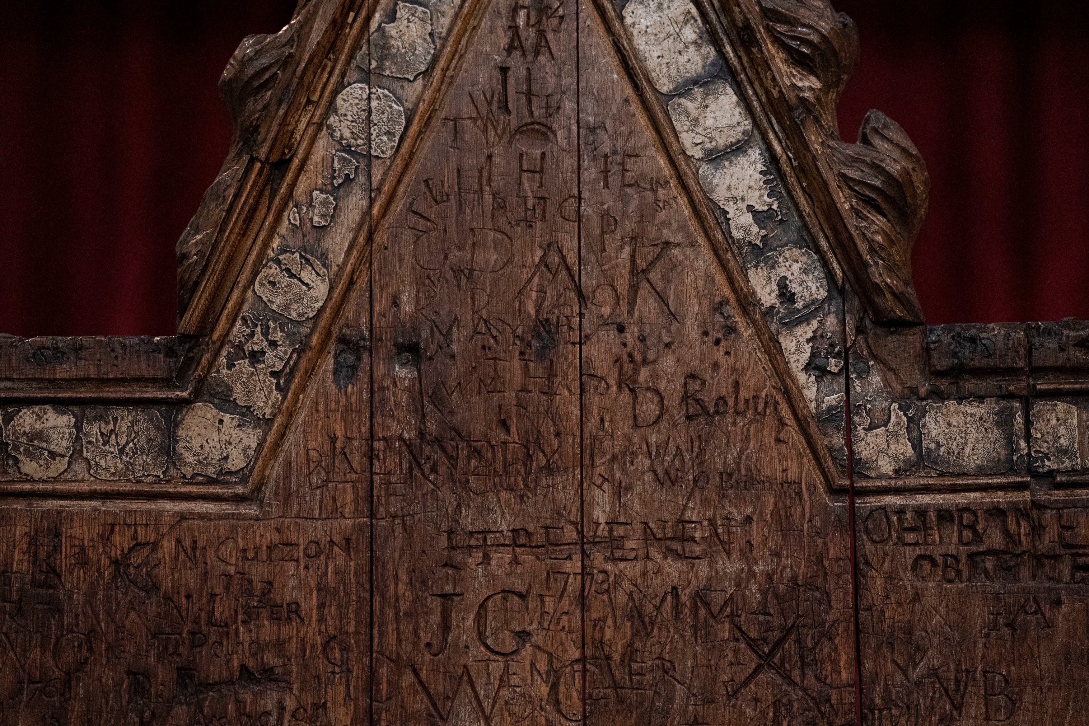 Detail of graffiti on the Coronation chair, at Westminster Abbey in London, which is being restored ahead of the upcoming coronation