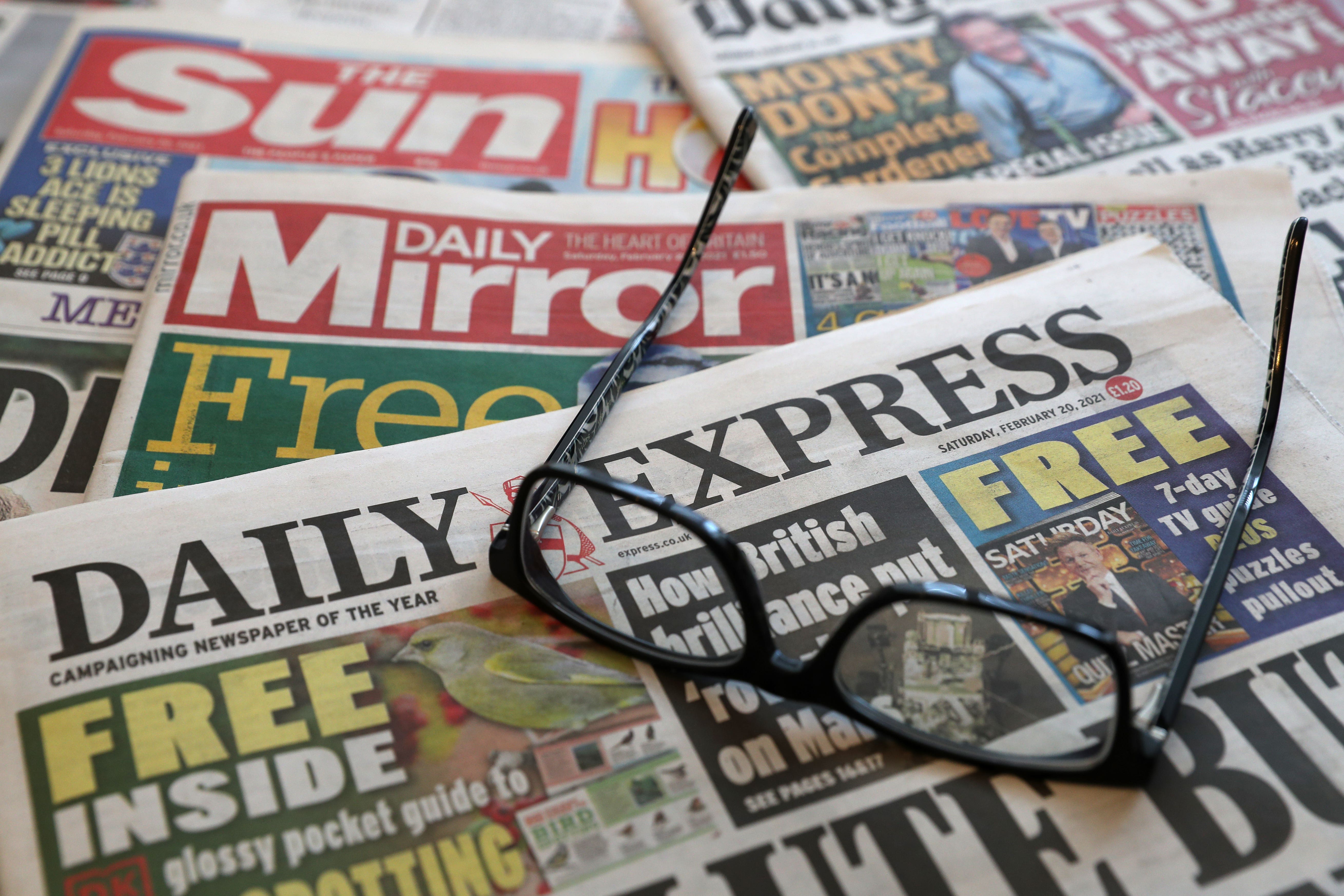 A stock image of a pile of newspapers including The Daily Telegraph, The Guardian, Daily Mirror, Daily Mail, Daily Express and The Sun. Picture date: Saturday February 20, 2021.