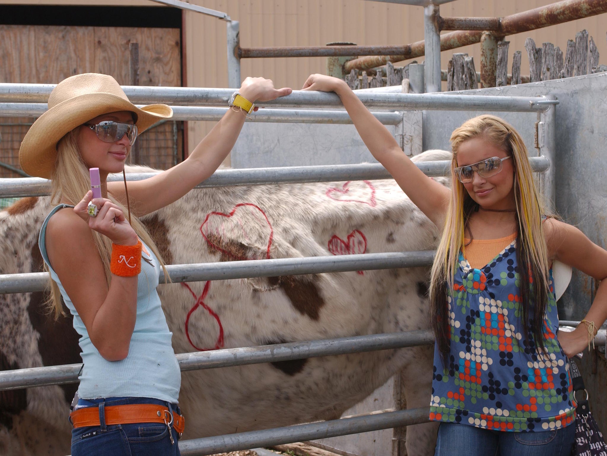 Moo point: Hilton and Nicole Richie pose with a cow during filming of their seminal reality series ‘The Simple Life’ in 2003