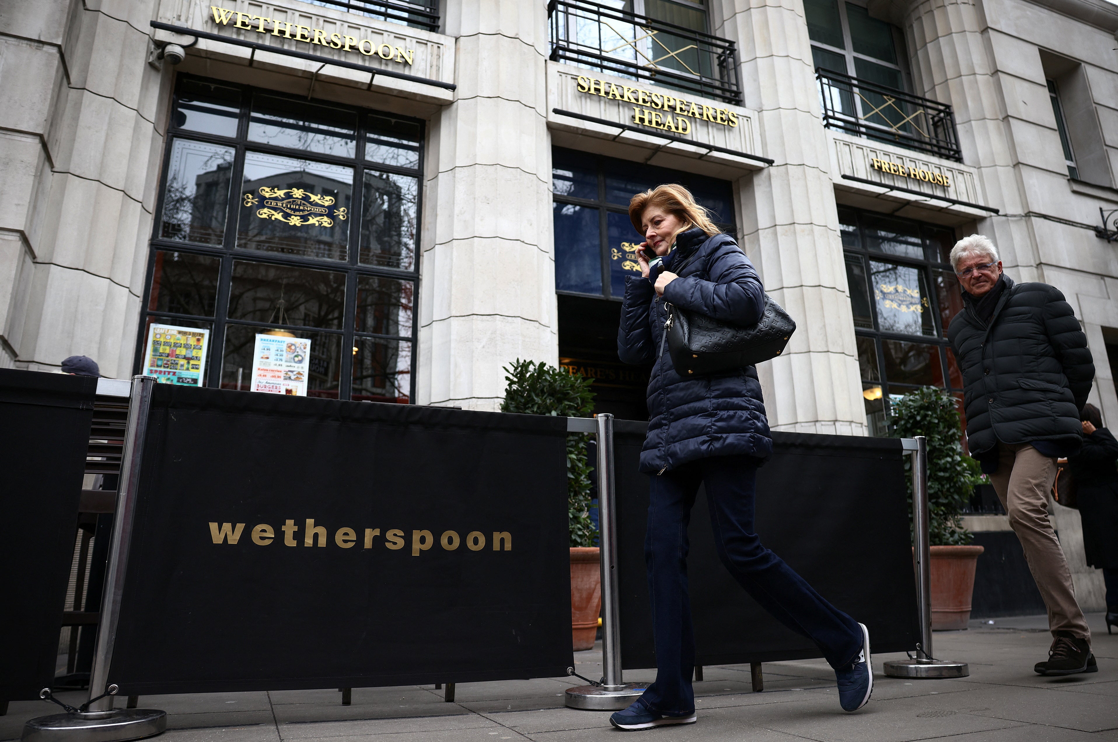 Signage is seen outside a JD Wetherspoon pub in central London, Britain, March 19, 2023