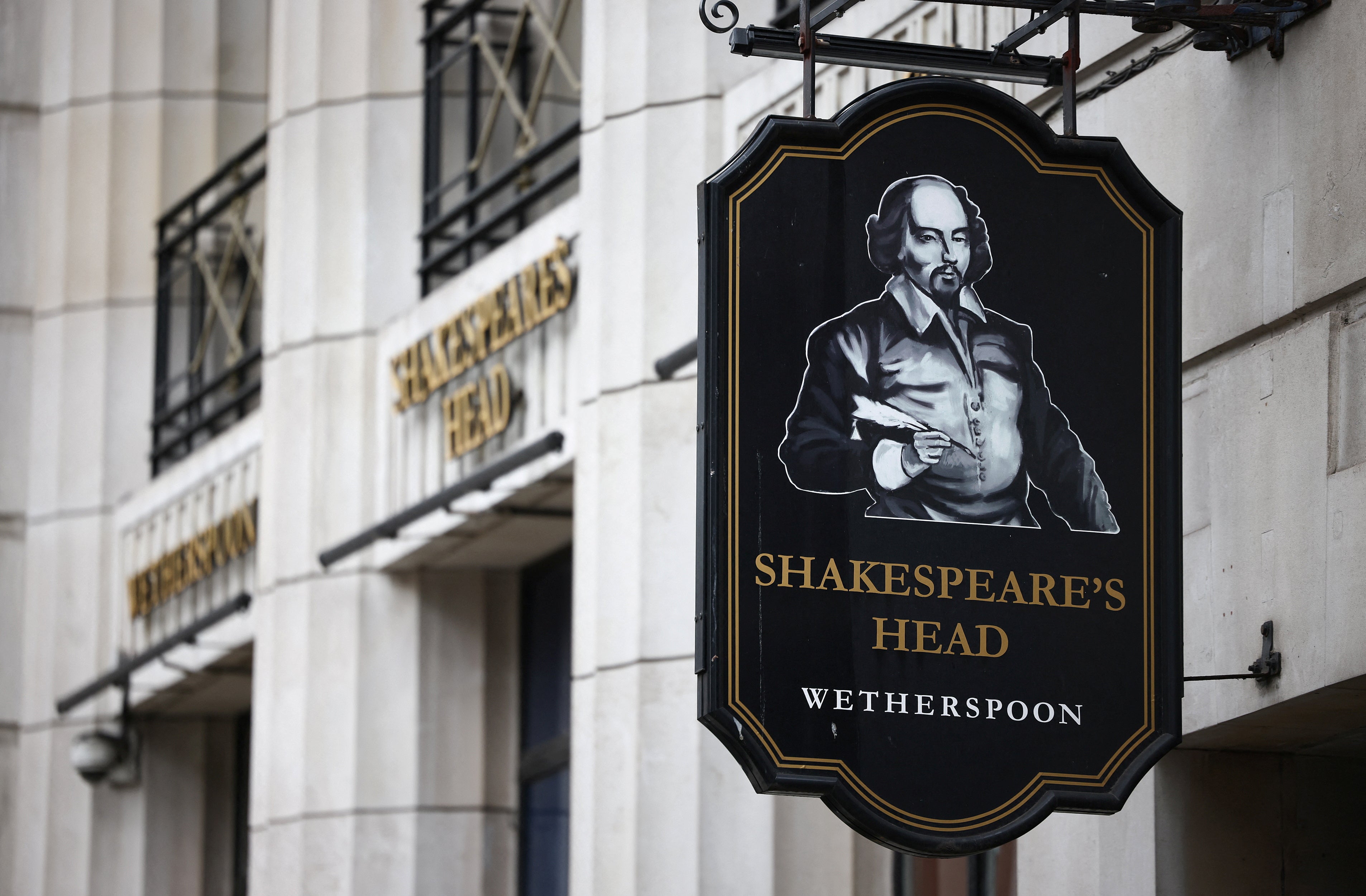 Signage is seen outside a JD Wetherspoon pub in central London, March 19, 2023