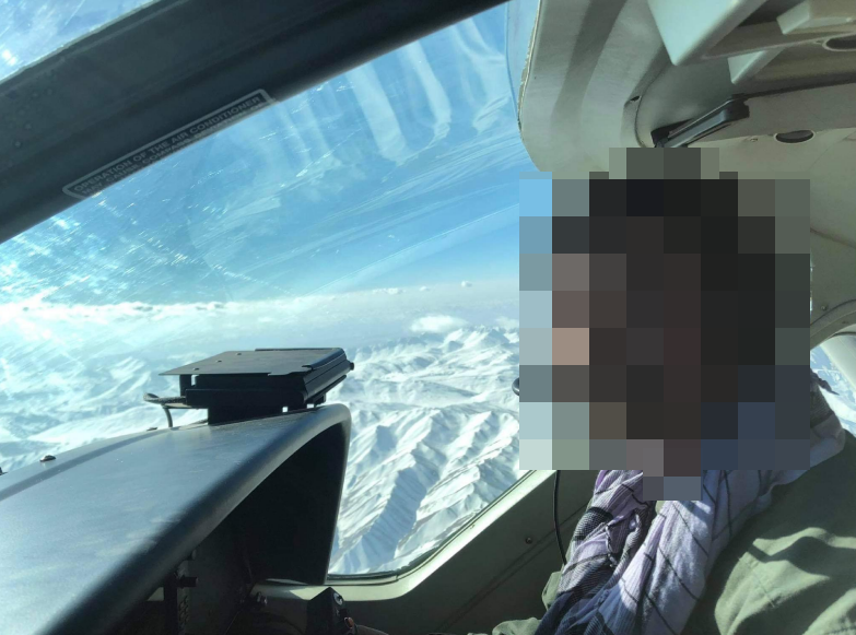 The Afghan pilot in the cockpit of his aircraft