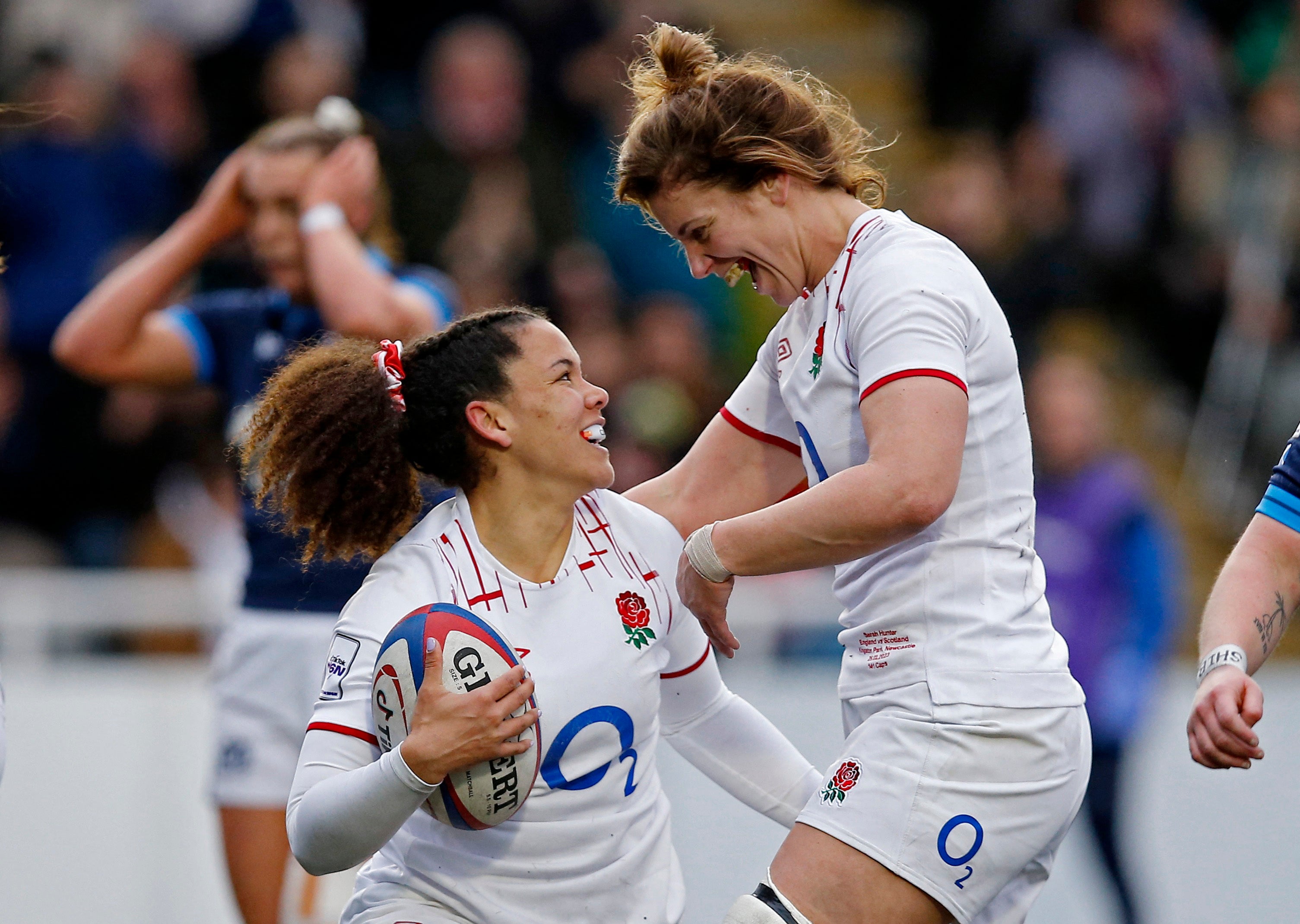 England's Tatyana Heard celebrates scoring their fourth try with Sarah Hunter