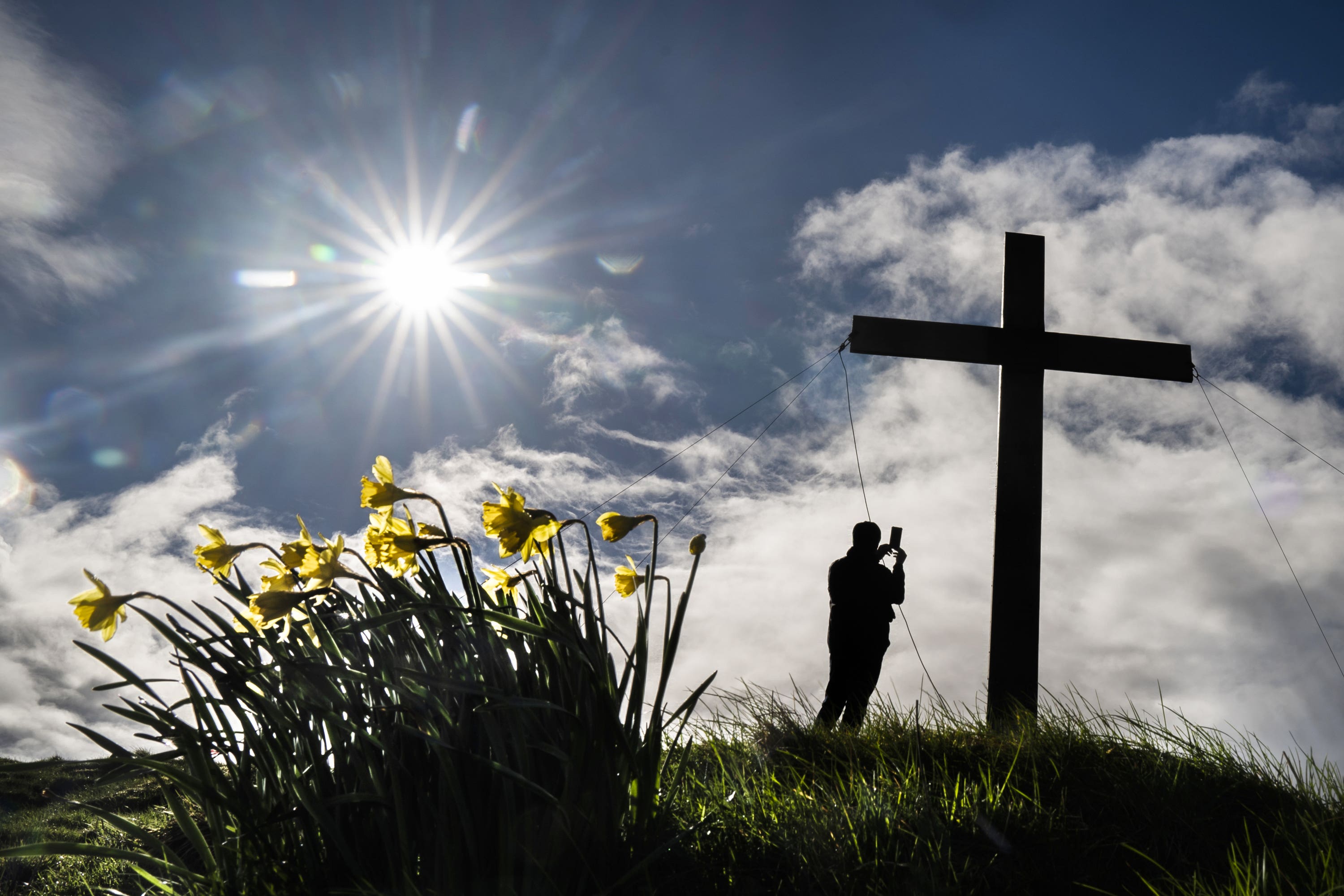 Christians erect a 30-foot high cross ahead of Easter on the top of Otley Chevin in Yorkshire (Danny Lawson/PA Wire)