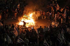 Israeli protesters light bonfires and block highway after Netanyahu sacks minister