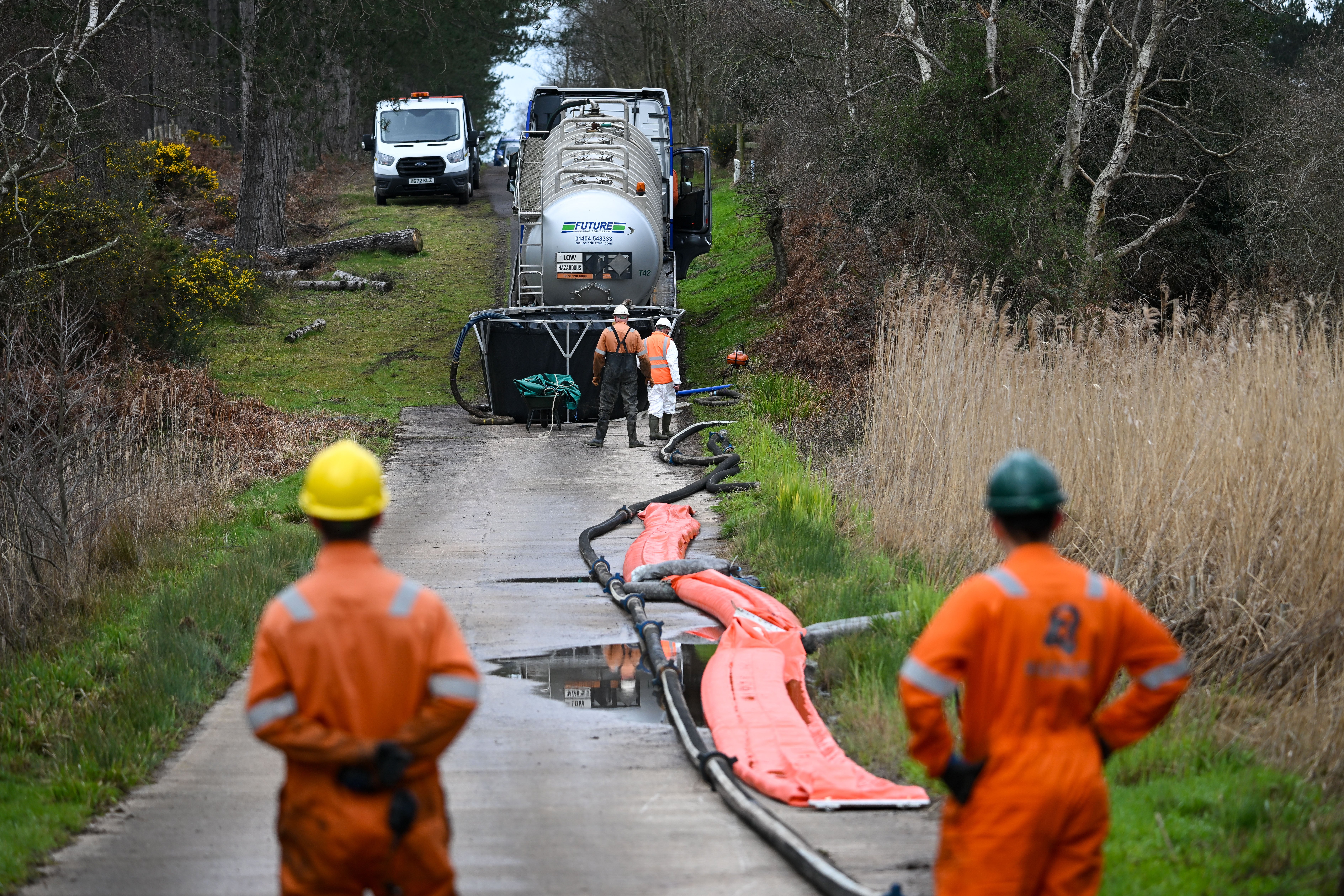 Oil workers at the scene at Wellsite D