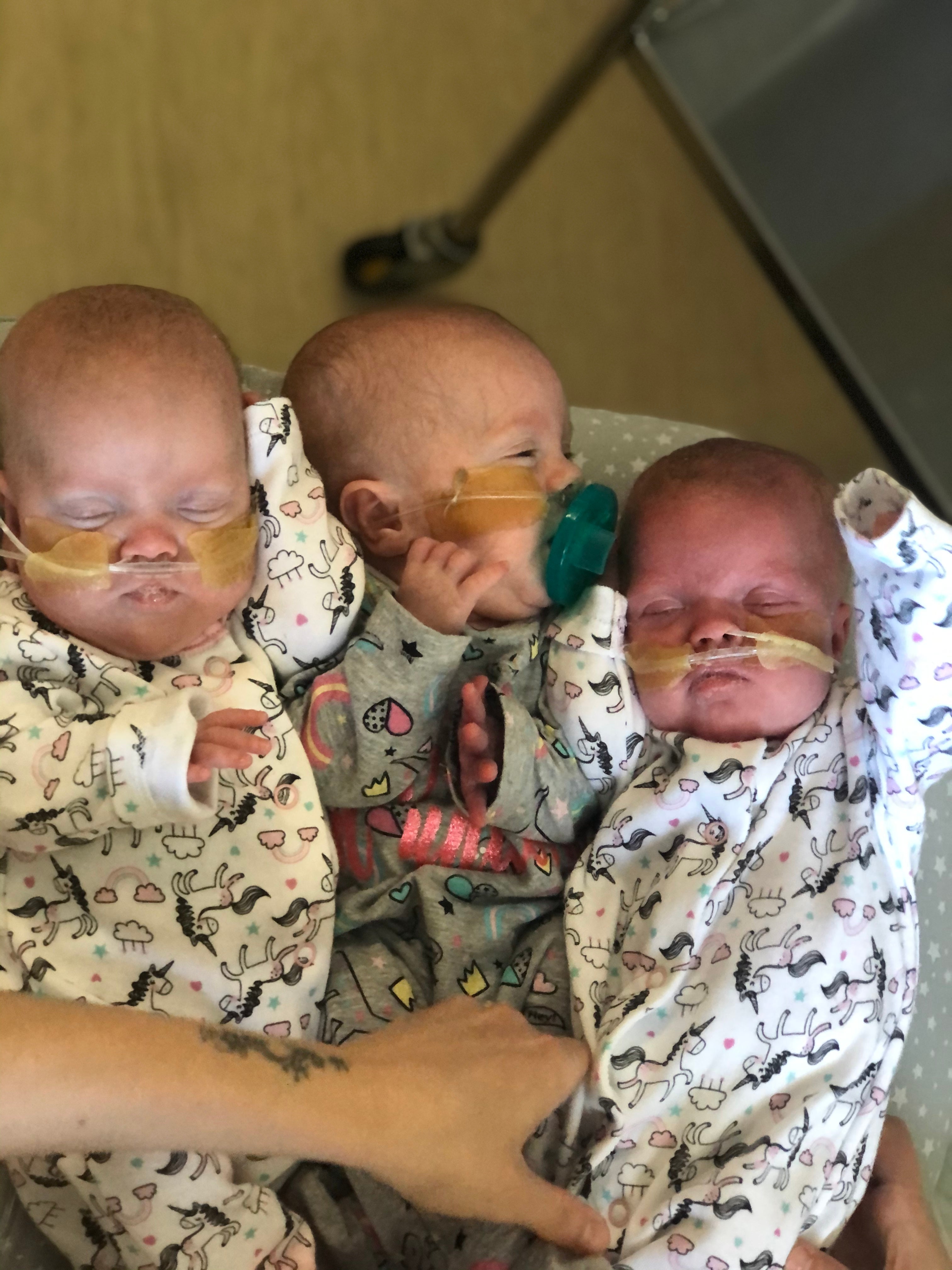 The triplets were born at just 22 weeks and five days with a combined weight of 1.284kg