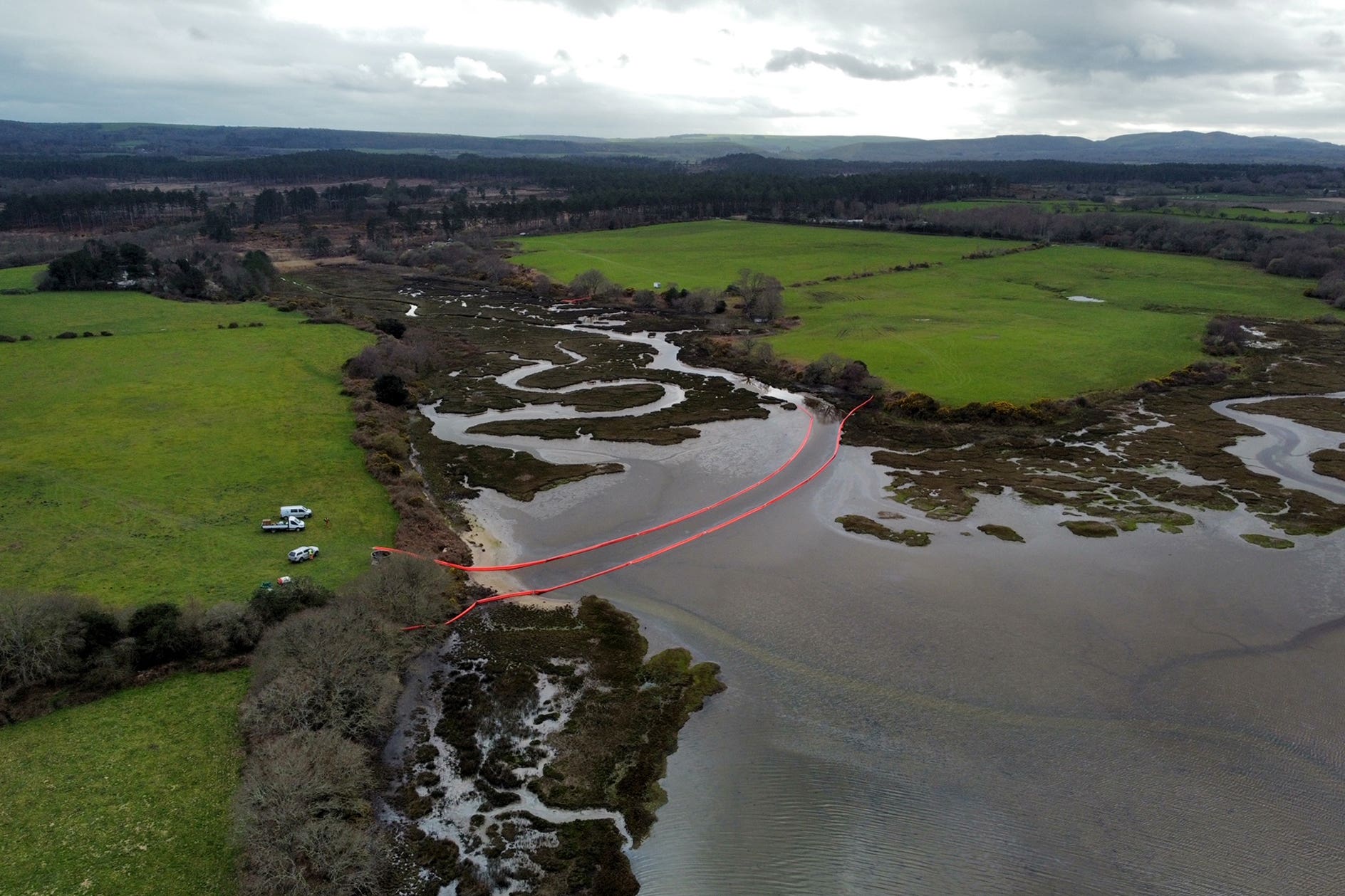 Oil is visible in the water of Poole Harbour, Dorset, following an oil leak from a pipeline at an onshore oil field at the weekend (Ben Birchall/PA)