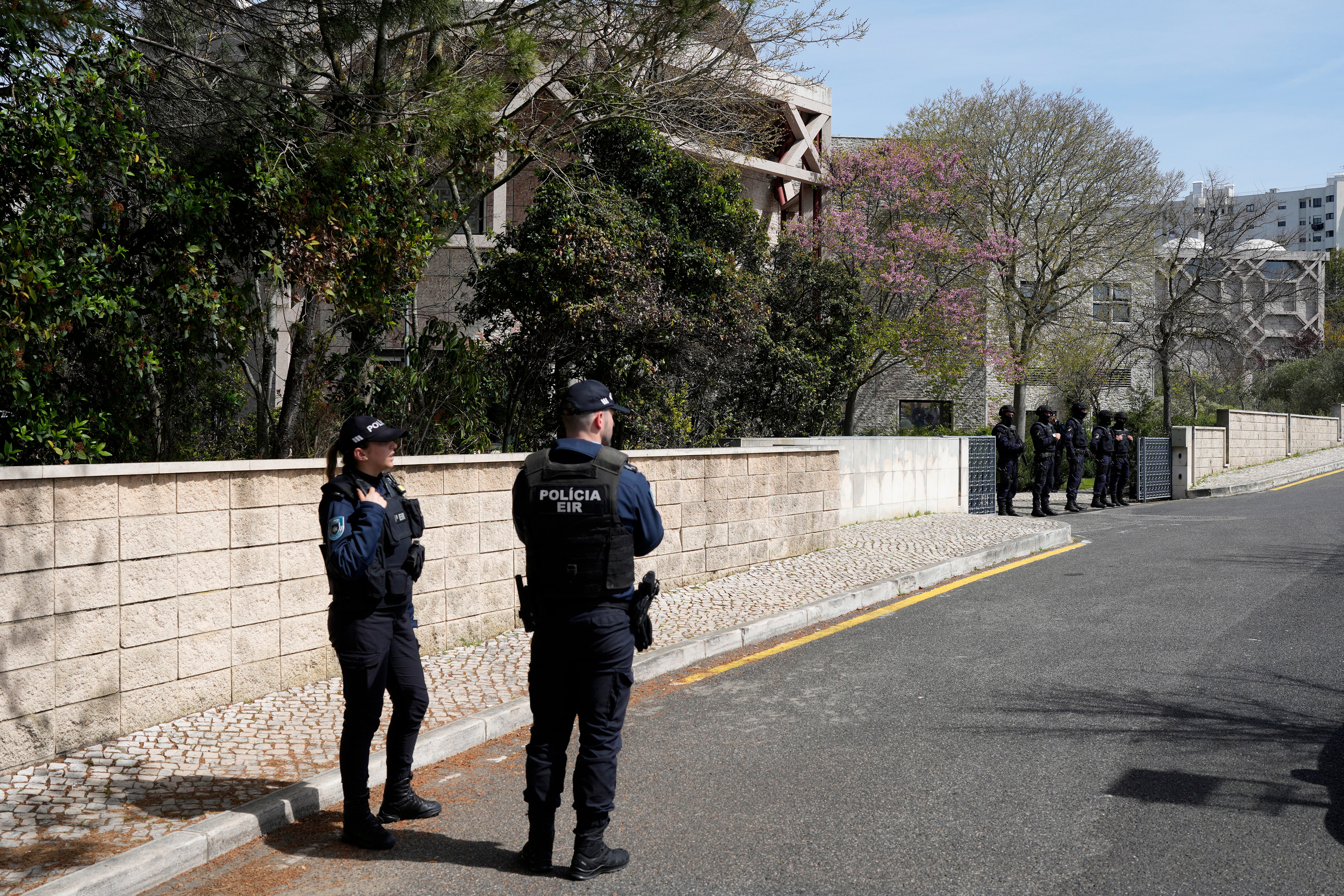 Armed police from a special operations unit could be seen forming a perimeter outside the building