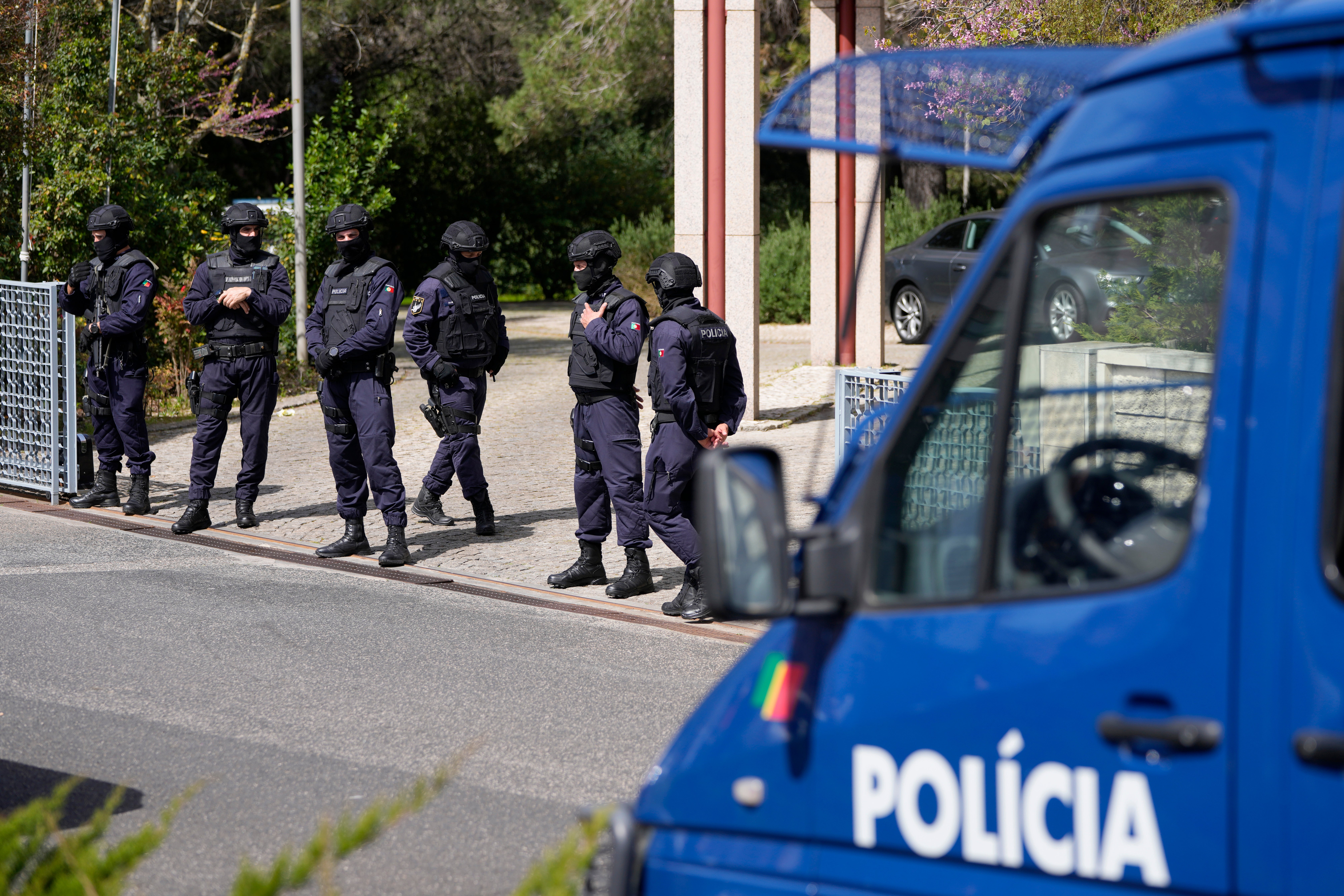 Portuguese police have shot a man suspected of stabbing two women to death at an Ismaili Muslim center in Lisbon