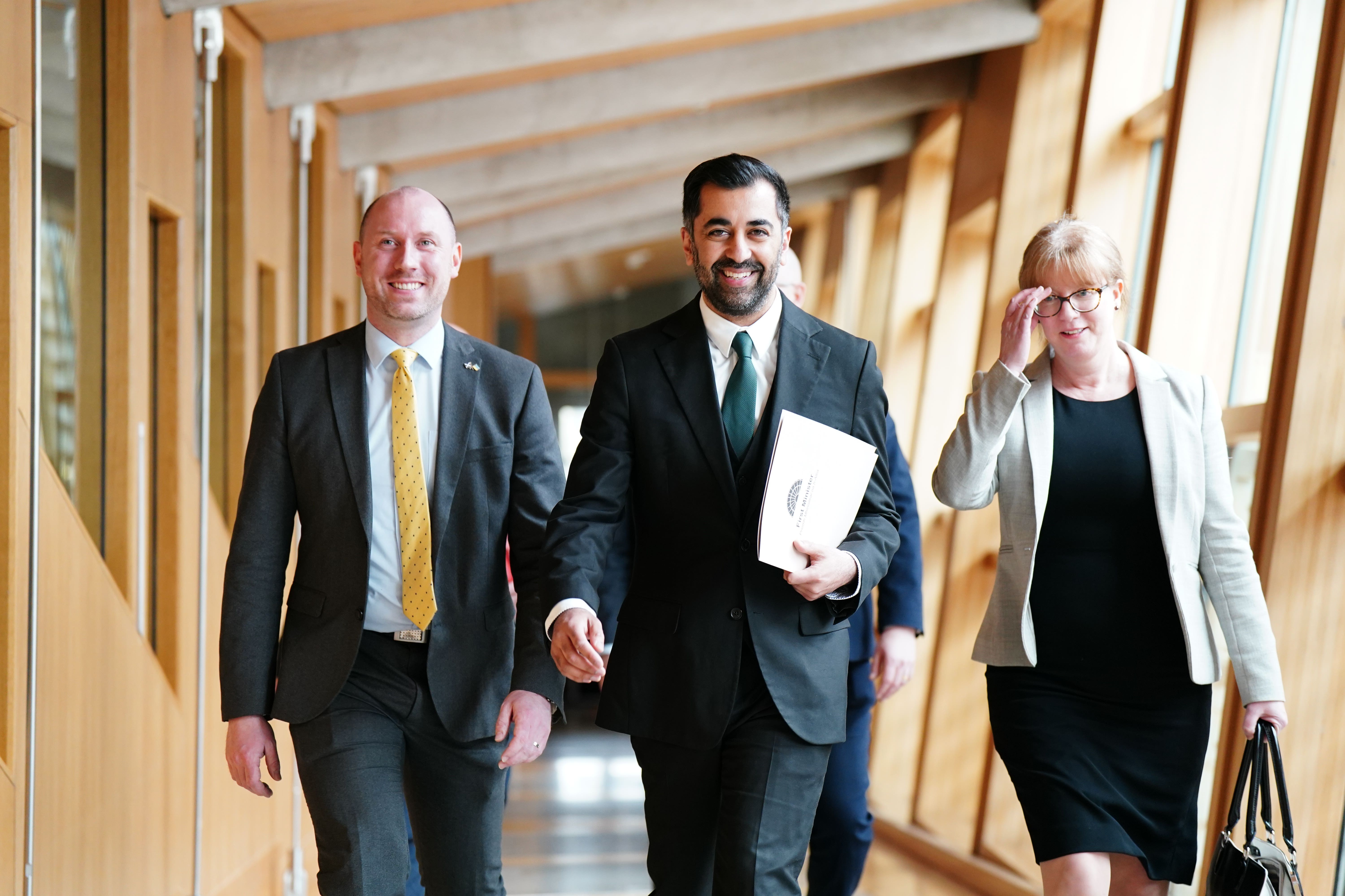 Humza Yousaf, with Neil Gray and Shona Robison (Jane Barlow/PA)