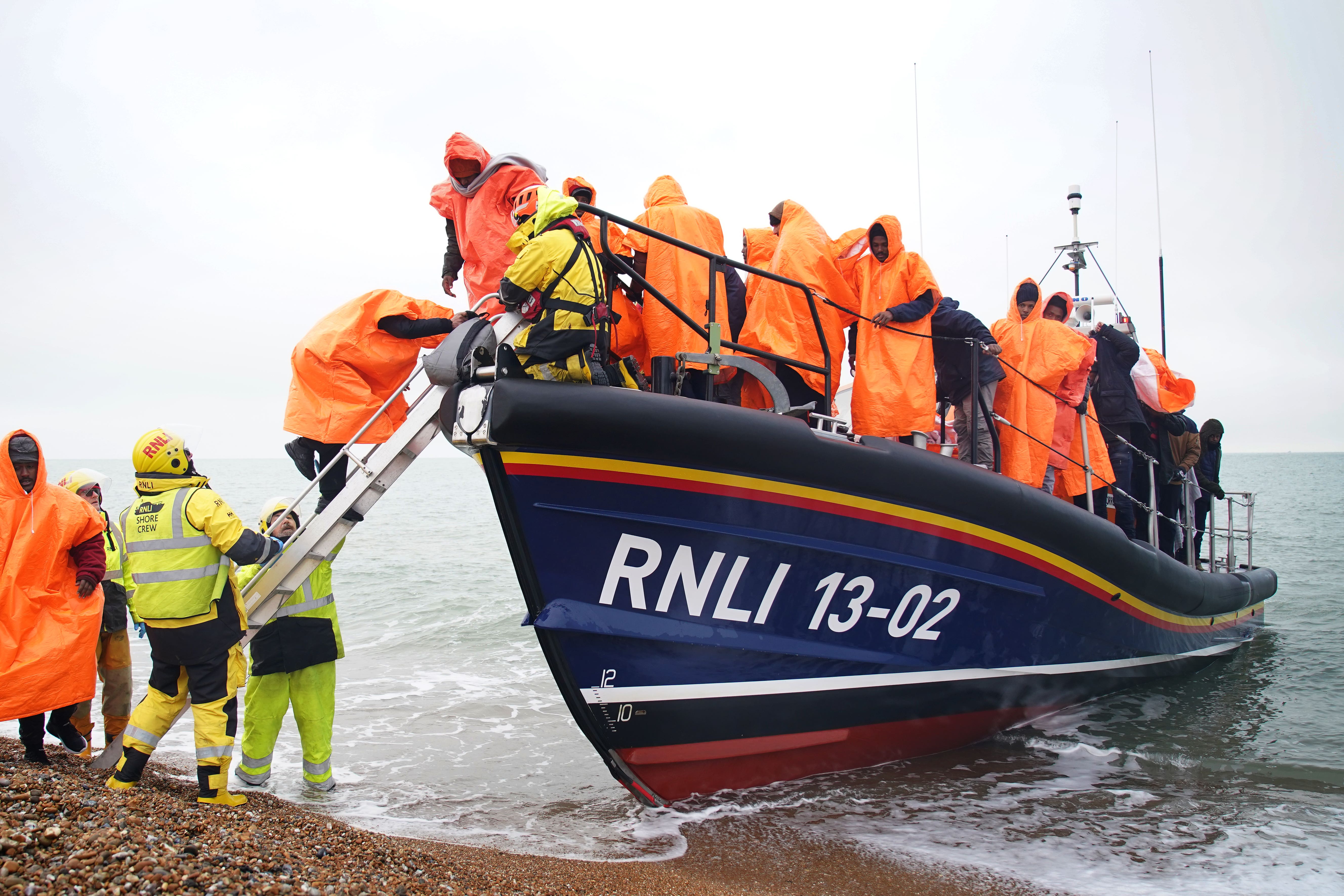 A group of people thought to be migrants are brought in to Dungeness, Kent (Gareth Fuller/PA)