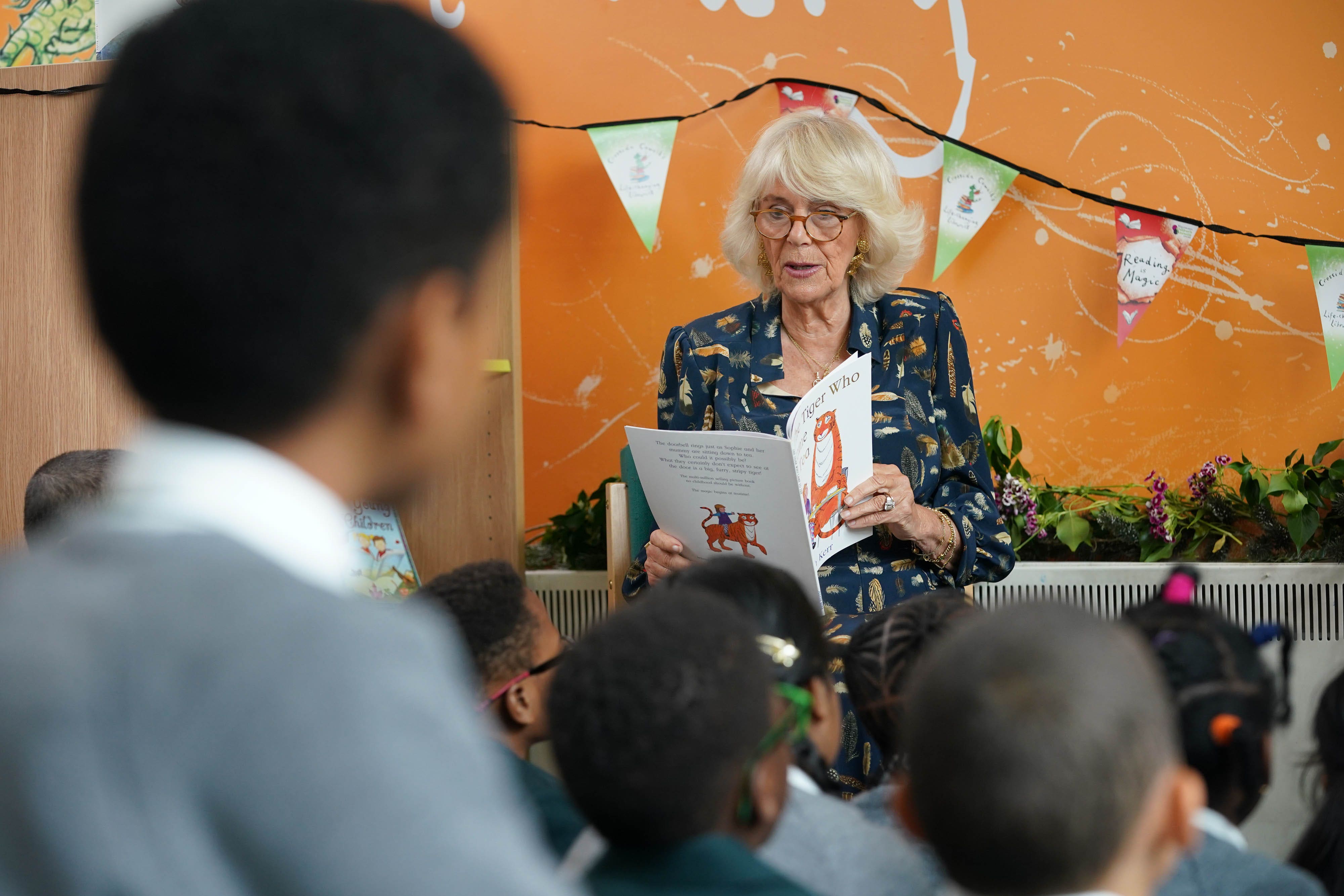 Camilla reading to schoolchildren (Yui Mok/PA)