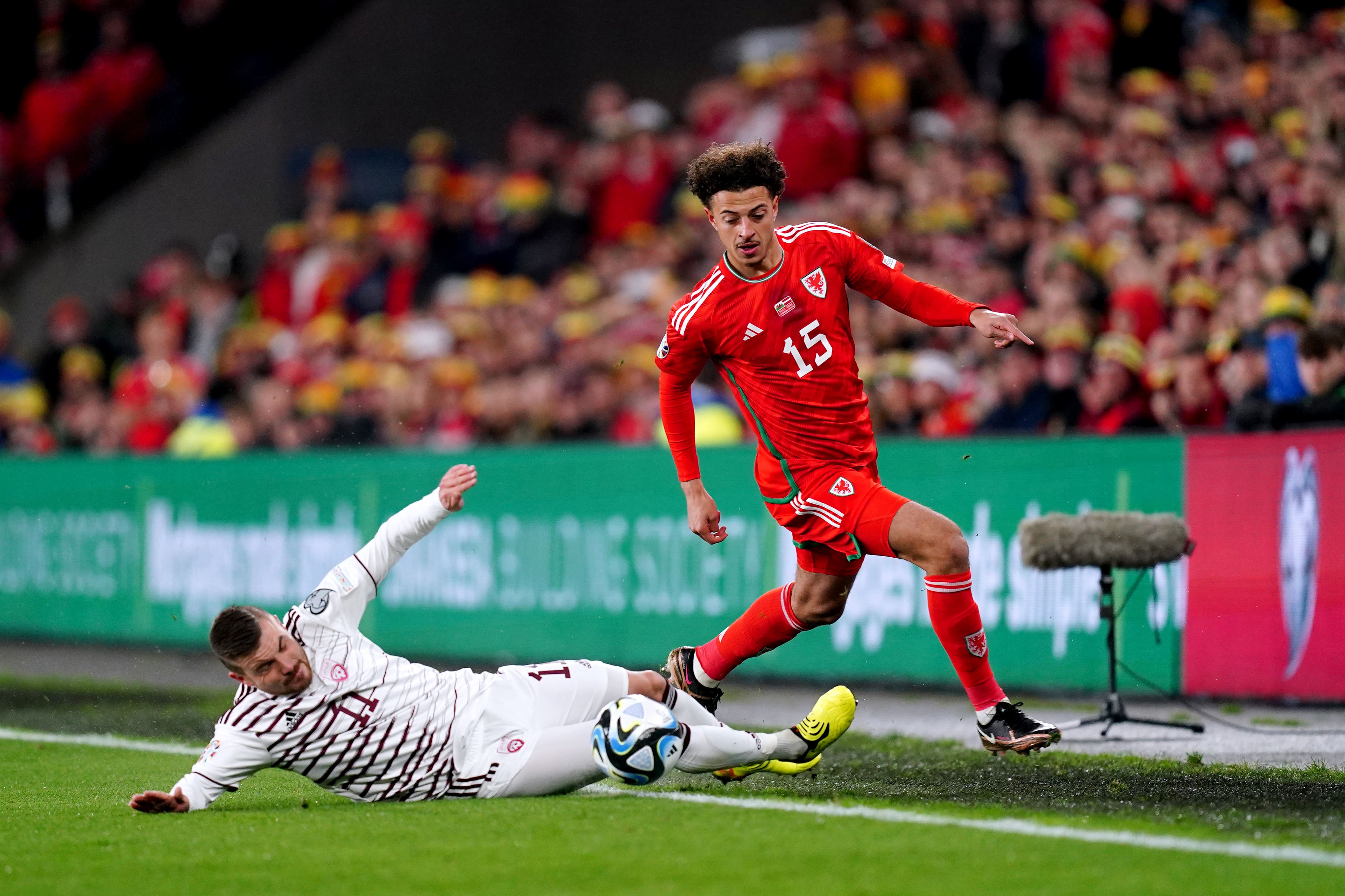 Ethan Ampadu (right) battles for possession with Latvia’s Roberts Savalnieks in Wales’ Euro 2024 qualifying win in Cardiff (David Davies/PA)