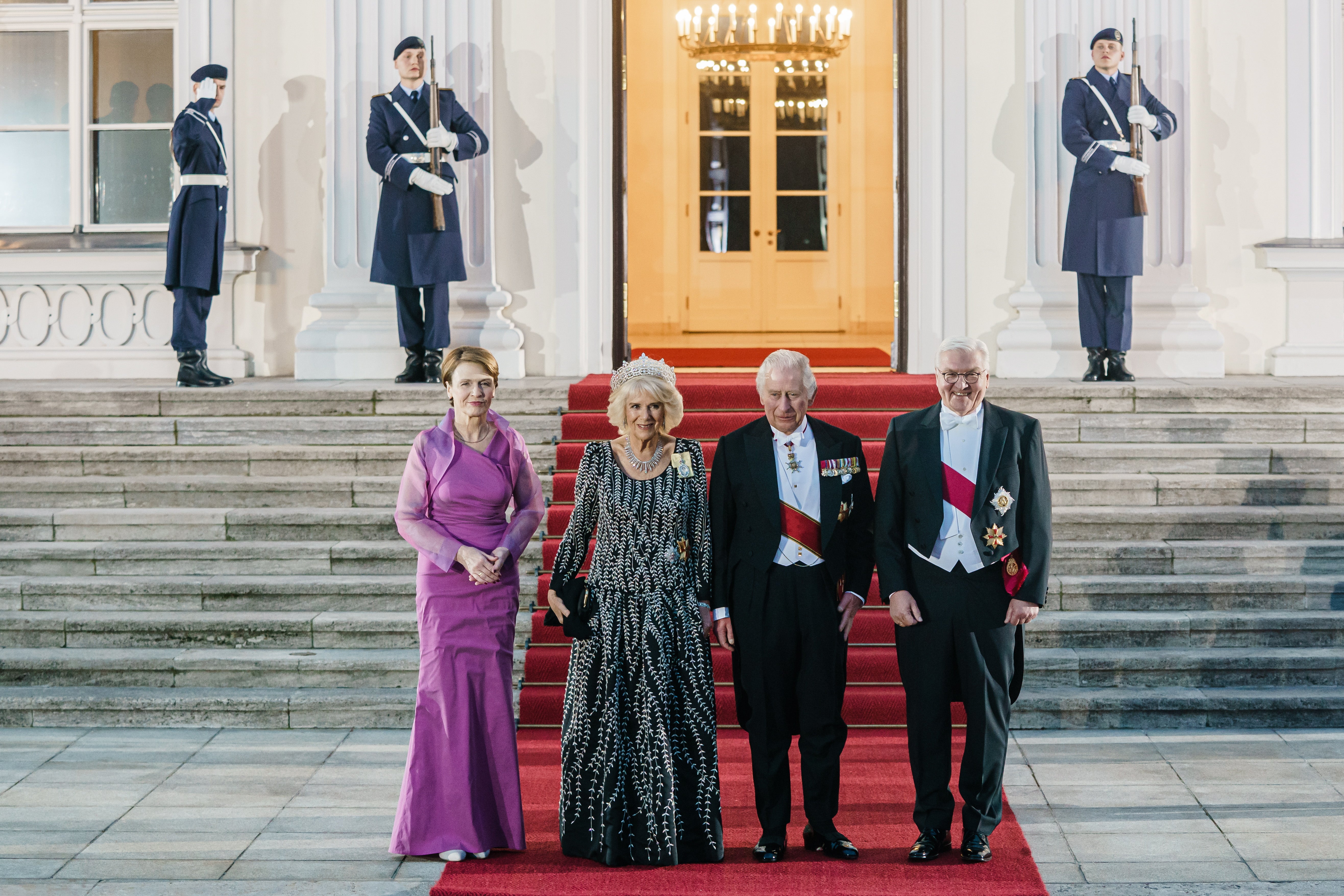 Britain's King Charles III (2-R), Camilla, The Queen Consort (2-L), German President Frank-Walter Steinmeier (R) and his wife Elke Buedenbender (L) arrive for a white tie dinner at presidential palace Schloss Bellevue in Berlin, Germany