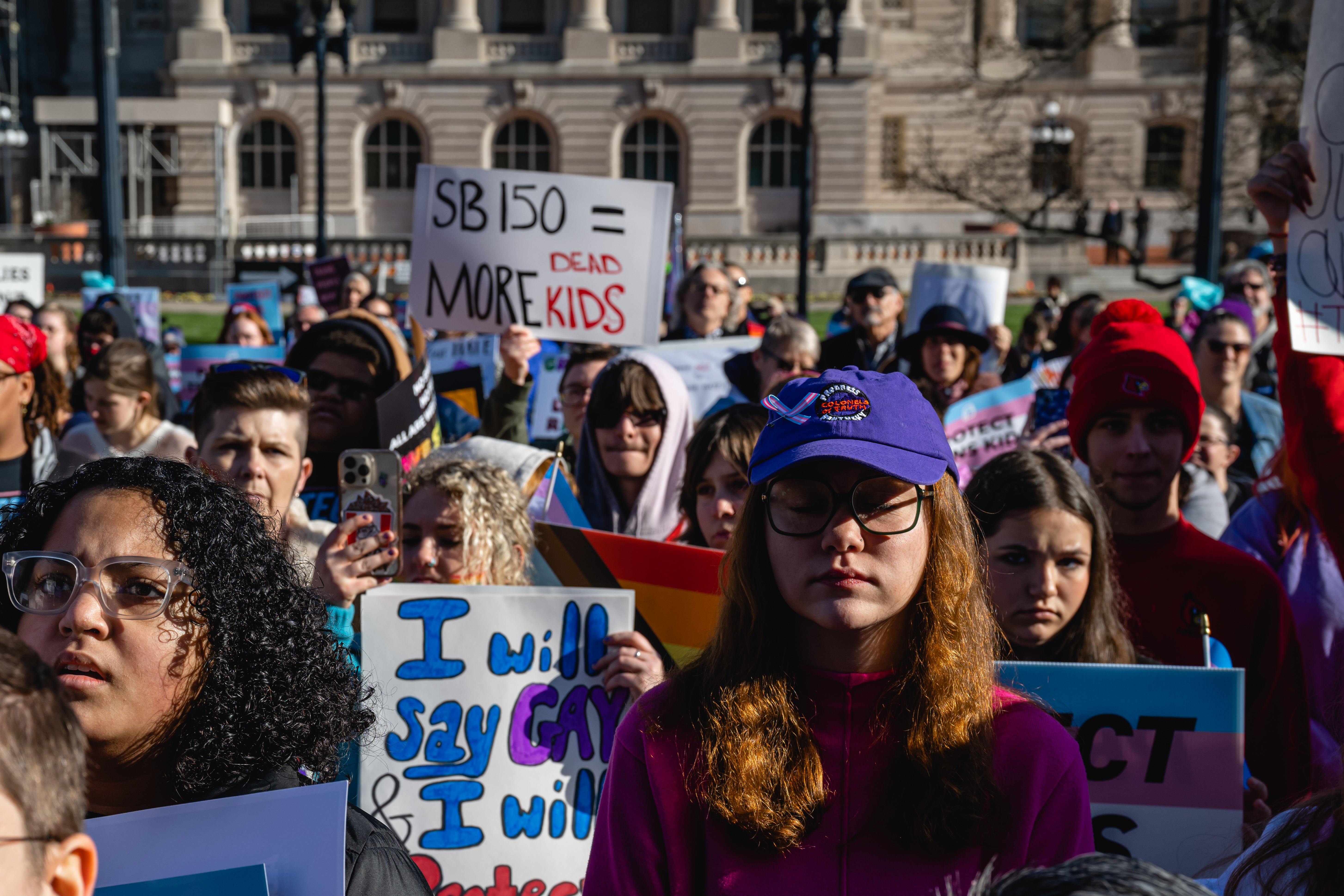 Protesters outside Kentucky’s state capitol in Frankfort demonstrate against a bill targeting trans children as Republican lawmakers voted to override Governor Andy Beshear’s veto on 29 March