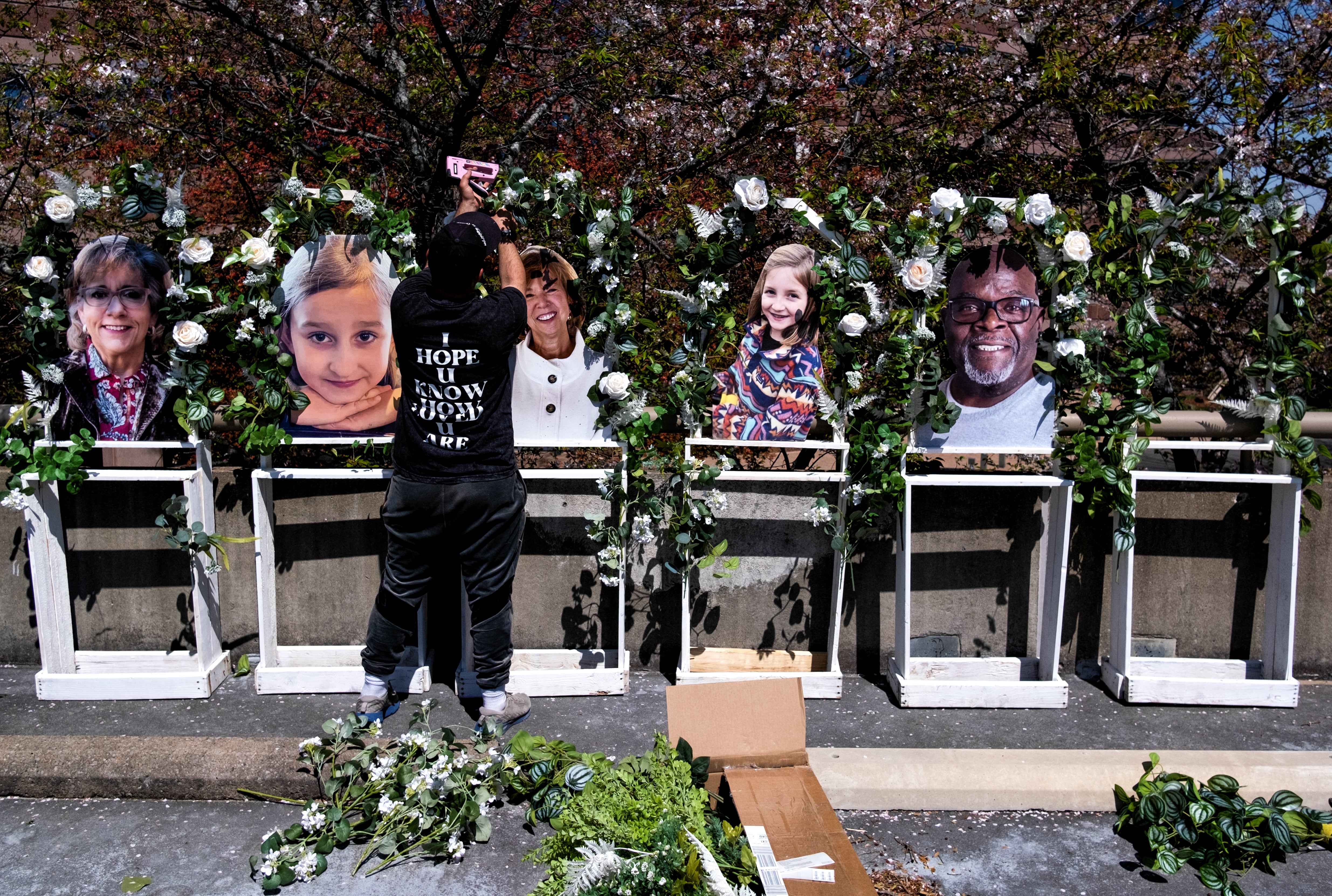 NASHVILLE, TN - MARCH 29: Pictures of the victims killed in a mass shooting on Monday at The Covenant School are fixed to a memorial by Noah Reich from the non-profit Classroom of Compassion, near the school on March 29, 2023 in Nashville, Tennessee. Three students and three adults were killed by the 28-year-old shooter. (Photo by Seth Herald/Getty Images)