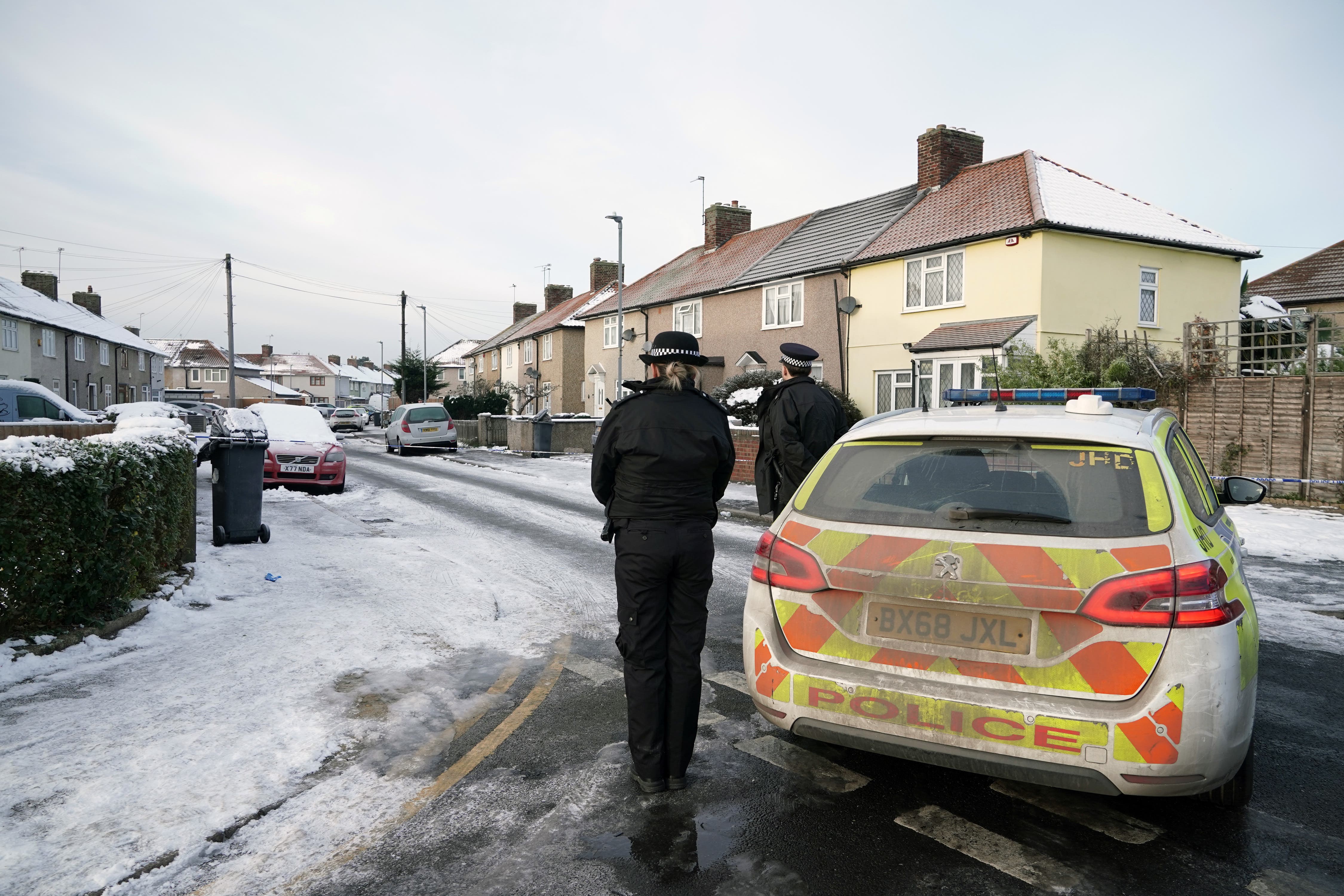 Police officers in Cornwallis Road, Dagenham, east London (PA)