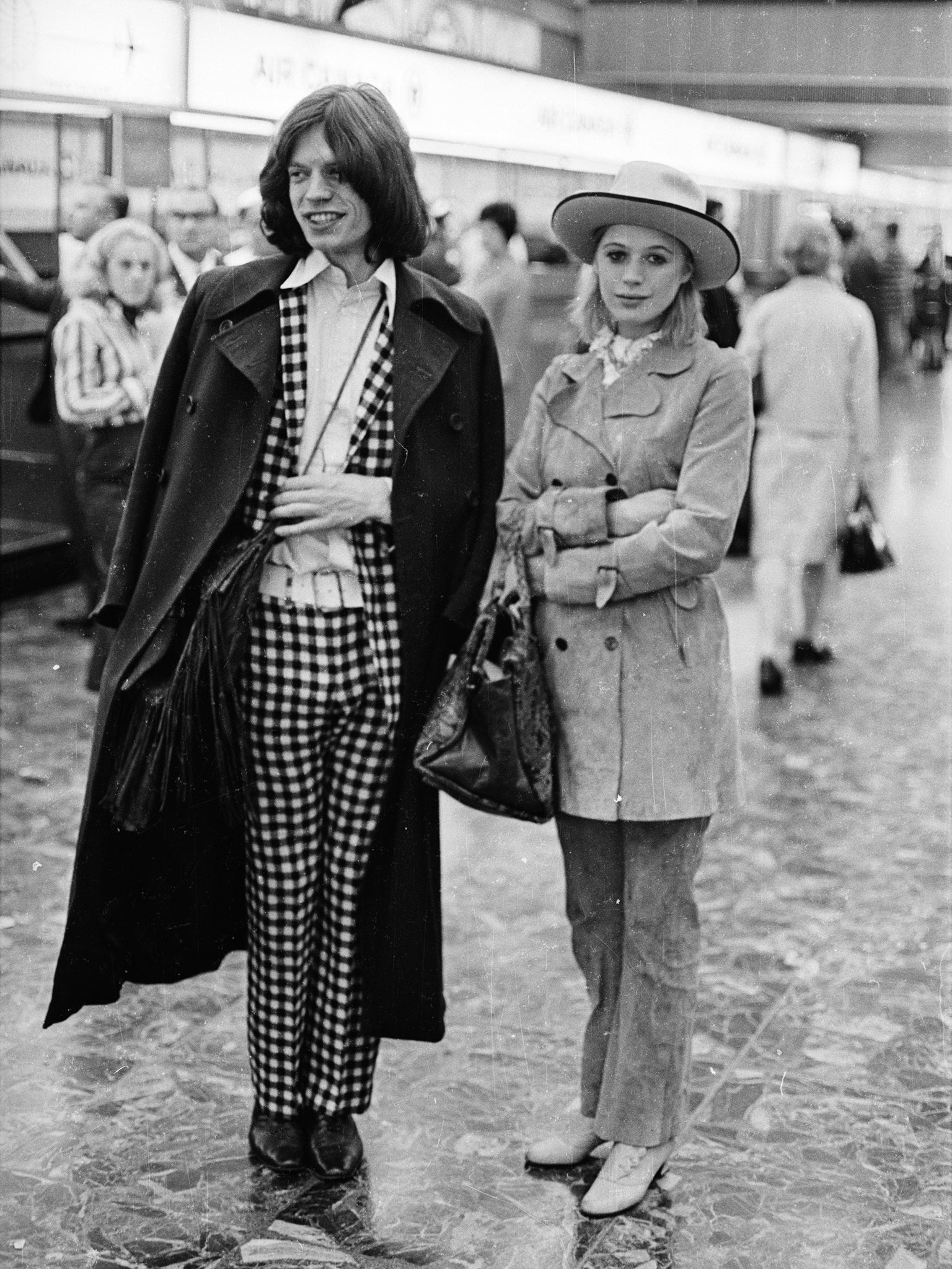 Marianne Faithfull and Mick Jagger at an airport in London in 1969