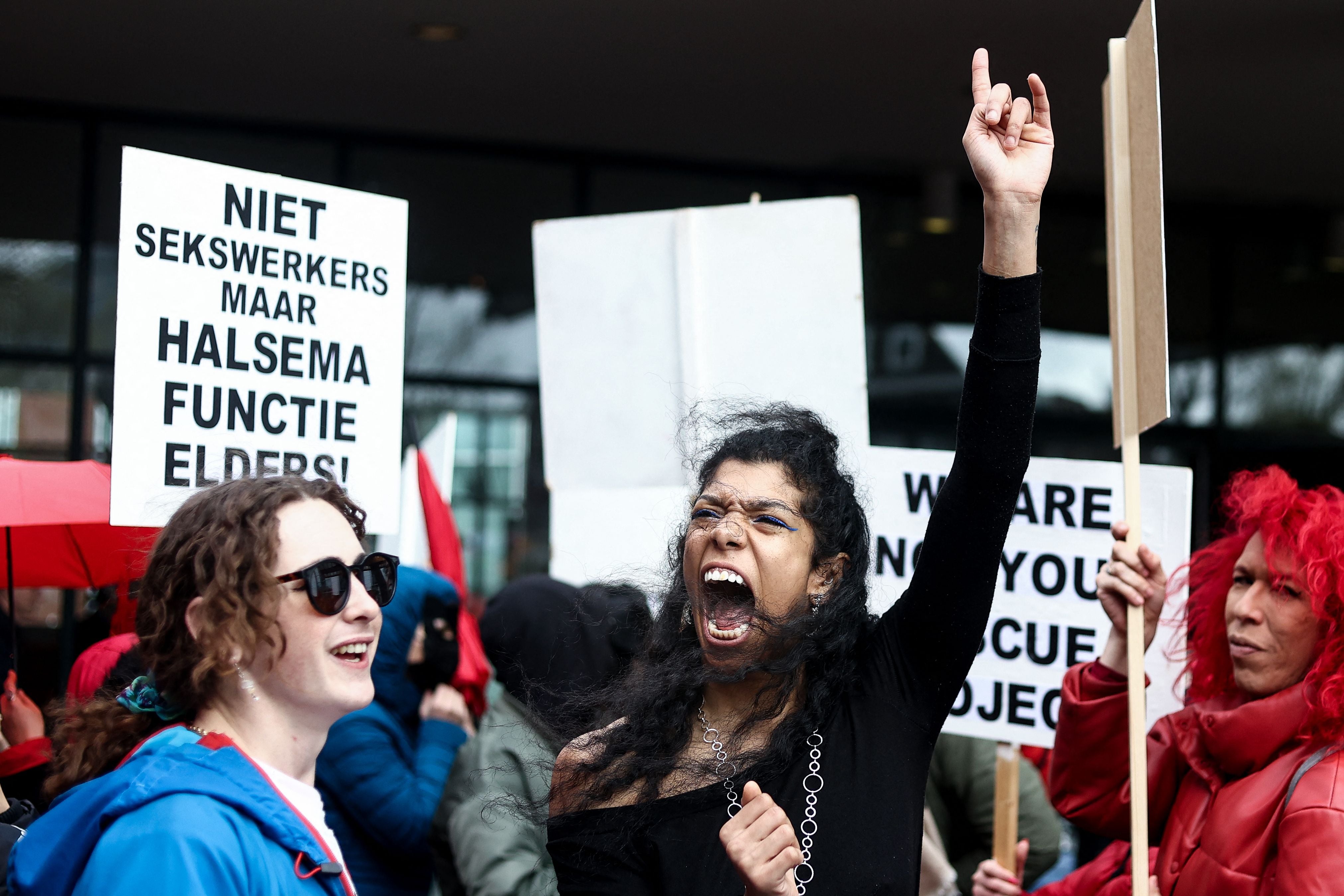 Sex workers and other people take part in a demonstration to protest plans to move the city’s historic red light district, to another area in Amsterdam