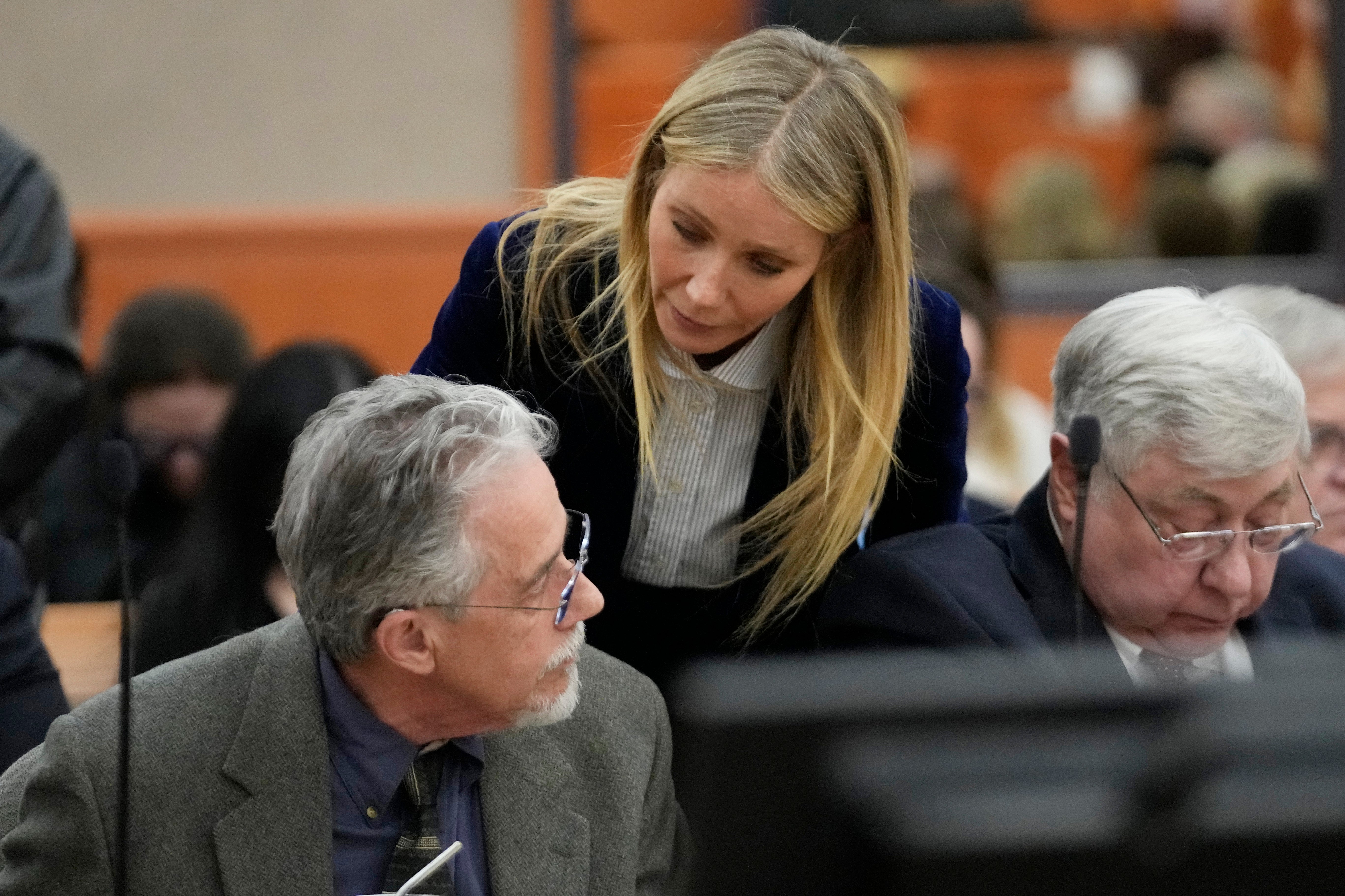 Gwyneth Paltrow speaks with retired optometrist Terry Sanderson,left, as she walks out of the courtroom following the reading of the verdict in their lawsuit trial, Thursday, March 30, 2023, in Park City, Utah