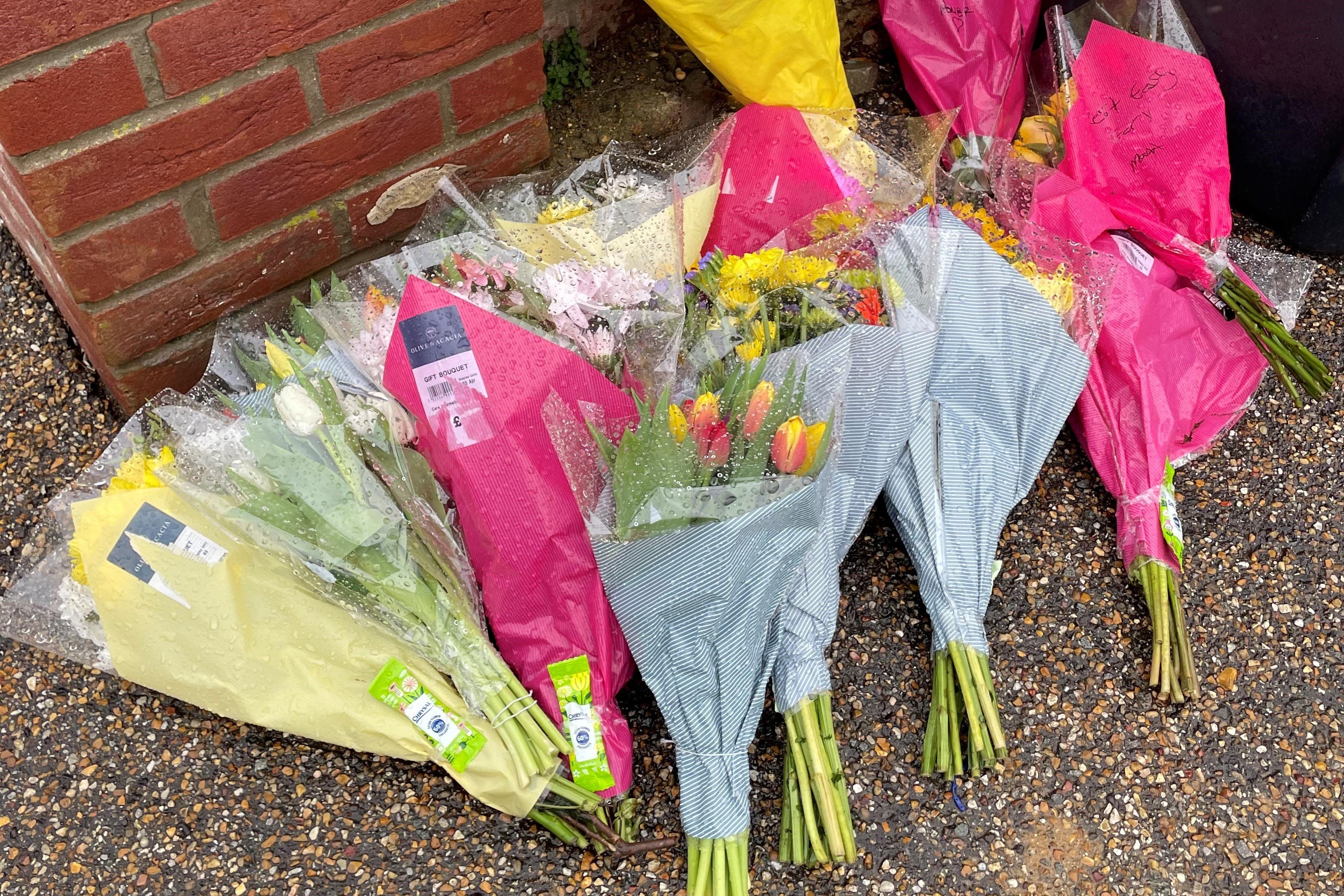 Floral tributes outside the home of Gary Dunmore, 57, who was shot dead in Sutton