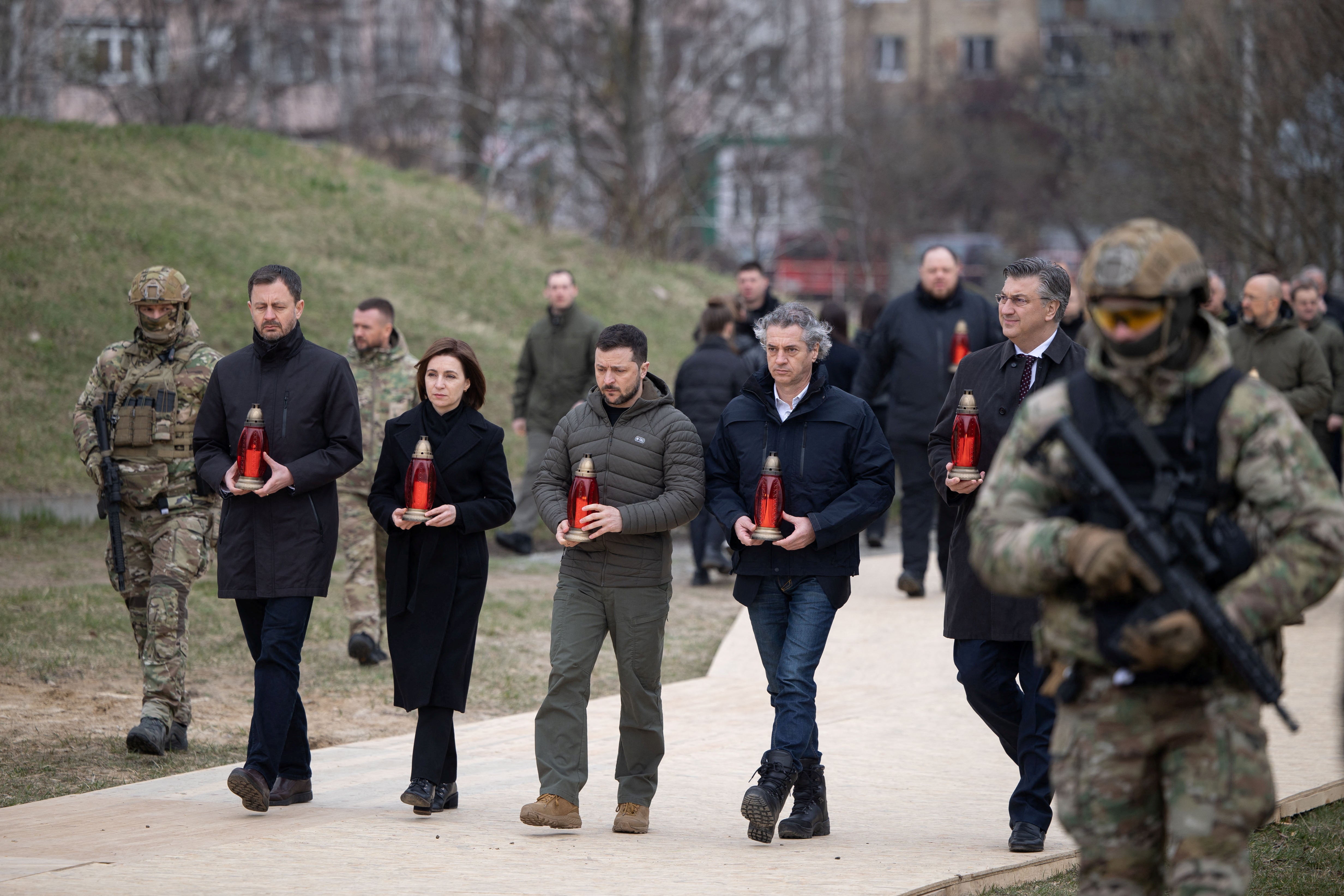 (From left to right) Slovenia's Prime Minister Robert Golob, Ukraine's President Volodymyr Zelensky, Moldovan President Maia Sandu, Croatian Prime Minister Andrej Plenkovic and Slovakian Prime Minister Eduard Heger attend a commemorative ceremony marking the first anniversary of liberation the town of Bucha