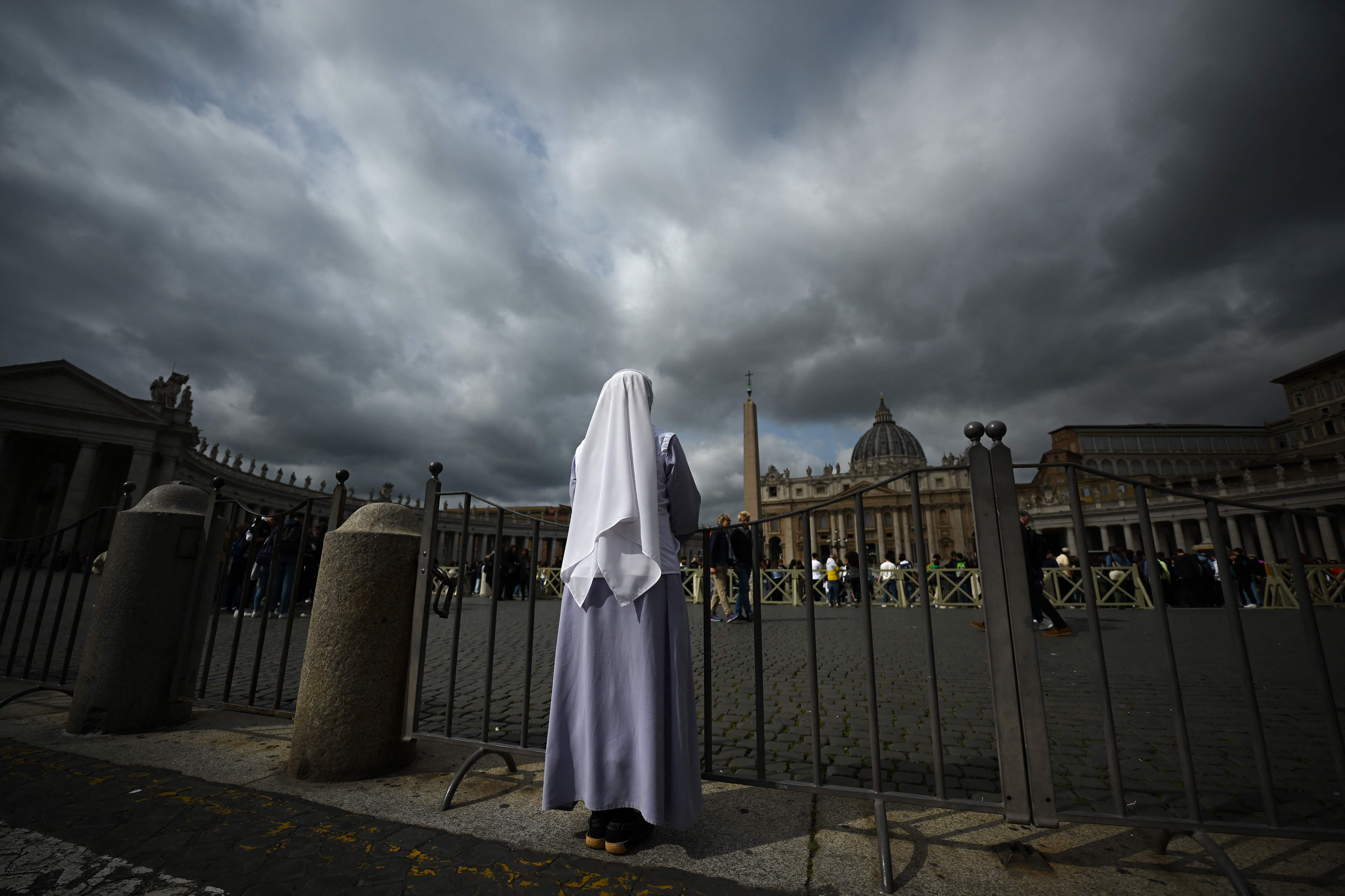 A nun stands at St. Peter's square on March 30, 2023 in The Vatican, a day after the Pope was admitted to the Gemelli hospital in Rome