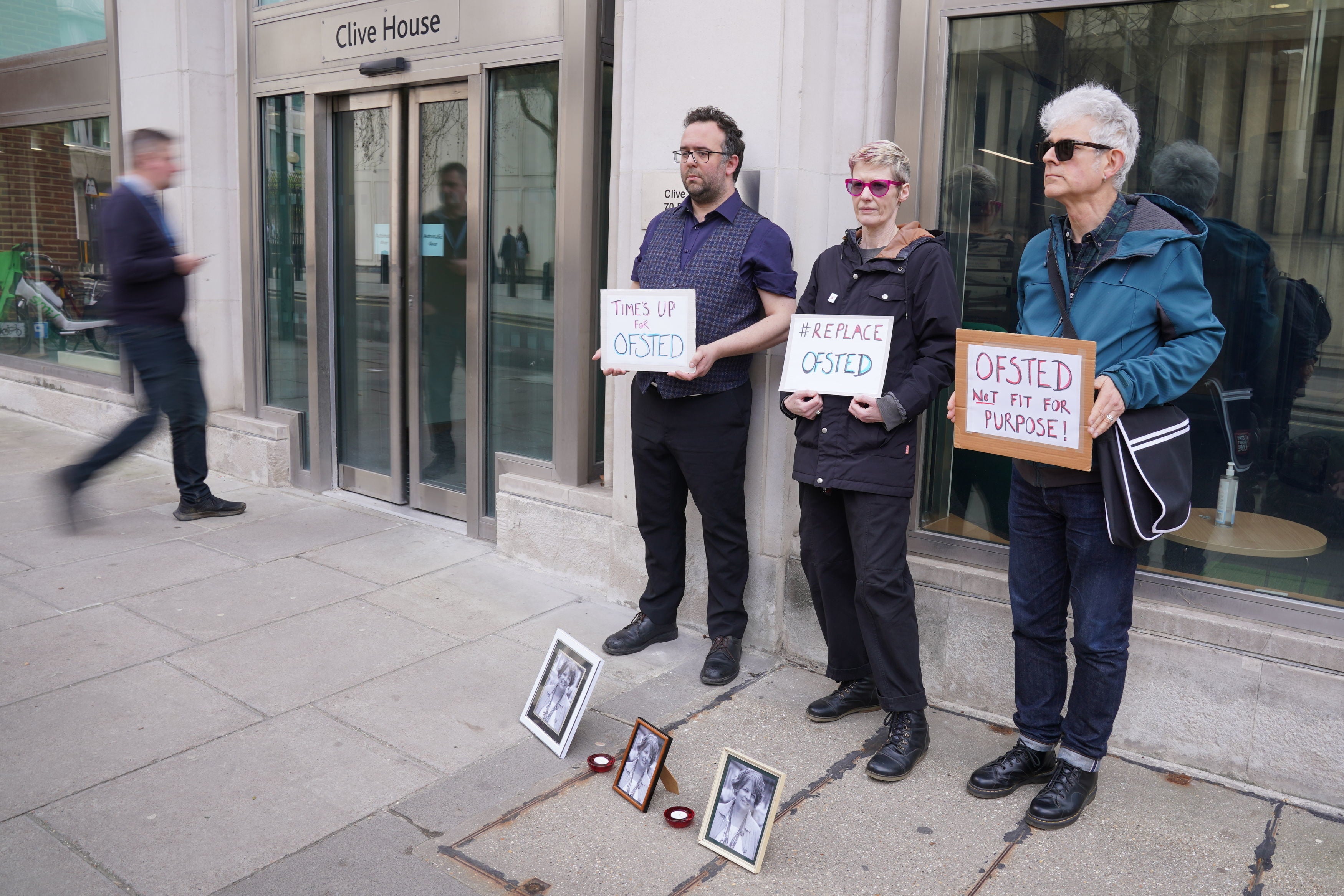 People attend a vigil for Ruth Perry outside the offices of Ofsted in Victoria, central London, after she took her own life while waiting for a negative Ofsted inspection report